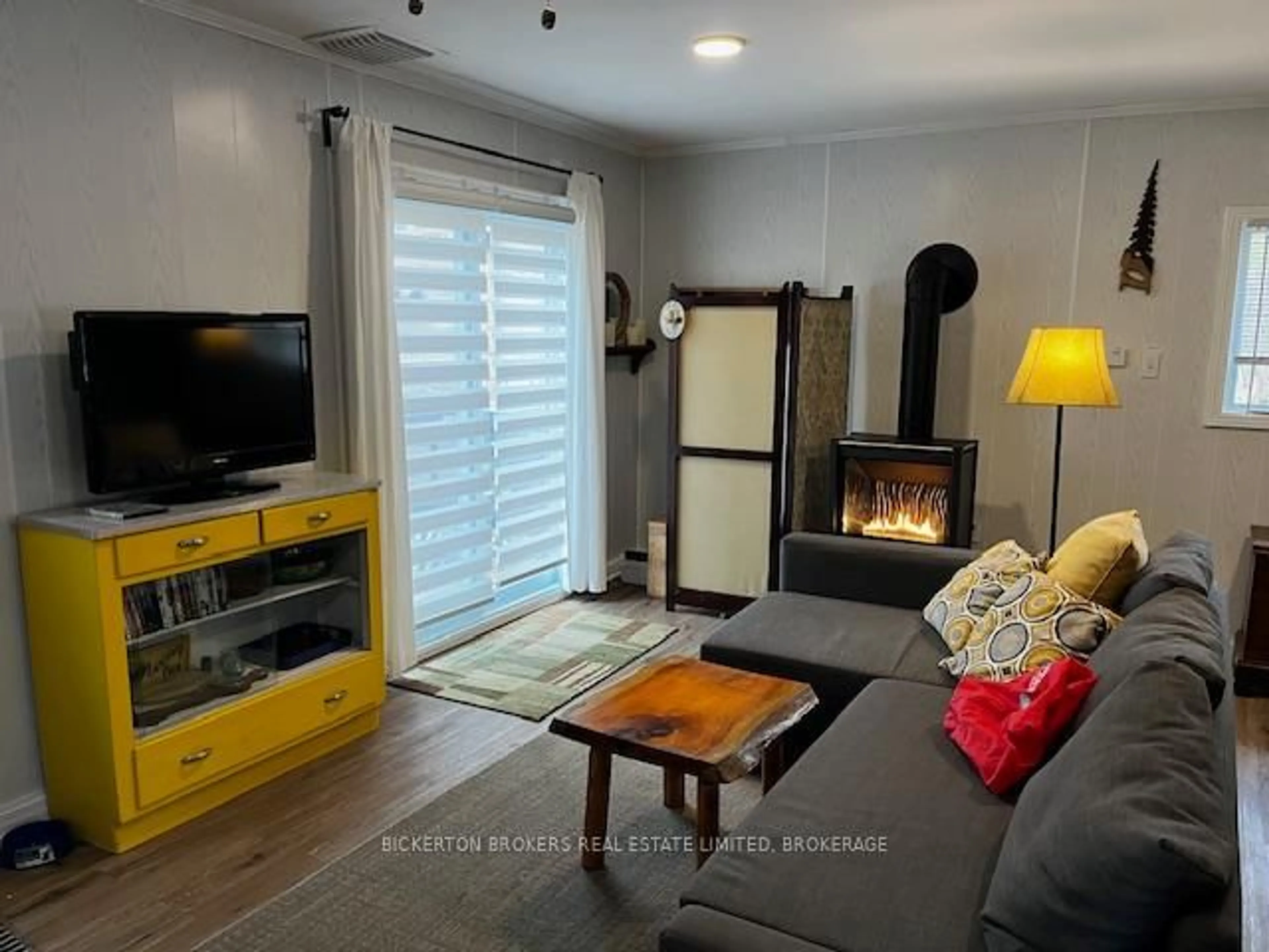 Living room with furniture, wood/laminate floor for 104 Cedar Sands Rd, Rideau Lakes Ontario K0E 1N0