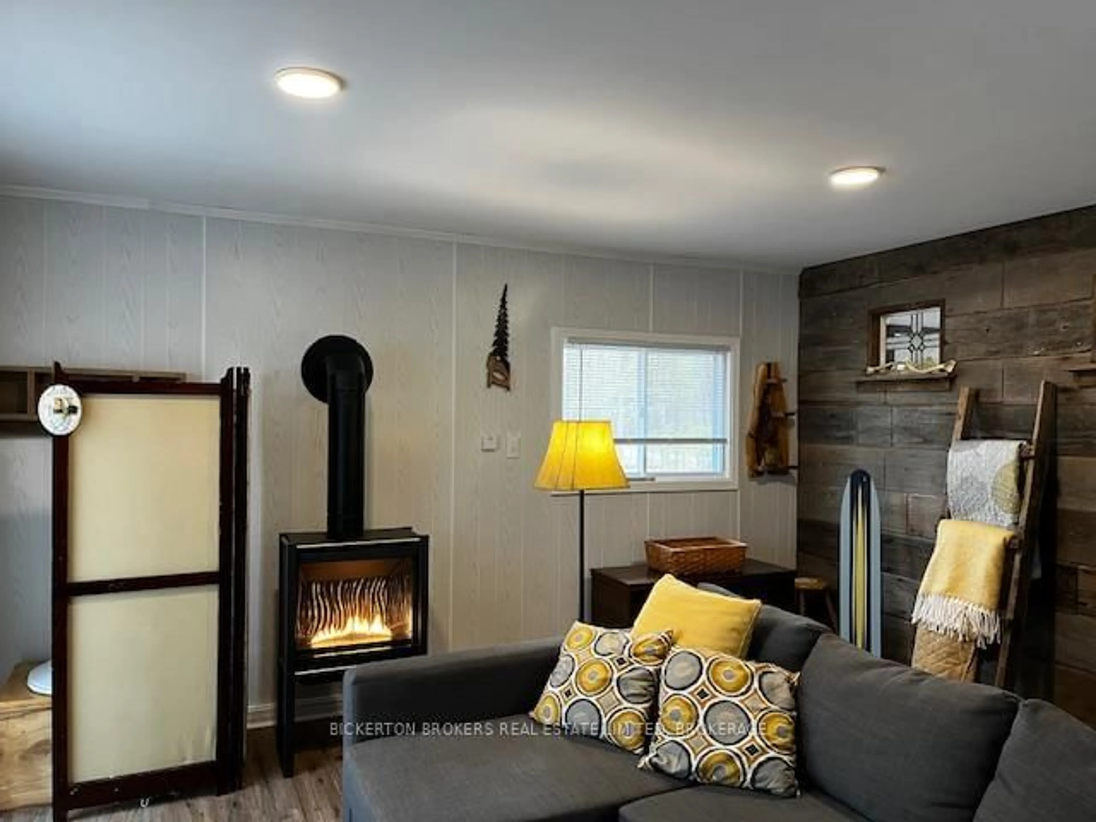 Living room with furniture, wood/laminate floor for 104 Cedar Sands Rd, Rideau Lakes Ontario K0E 1N0