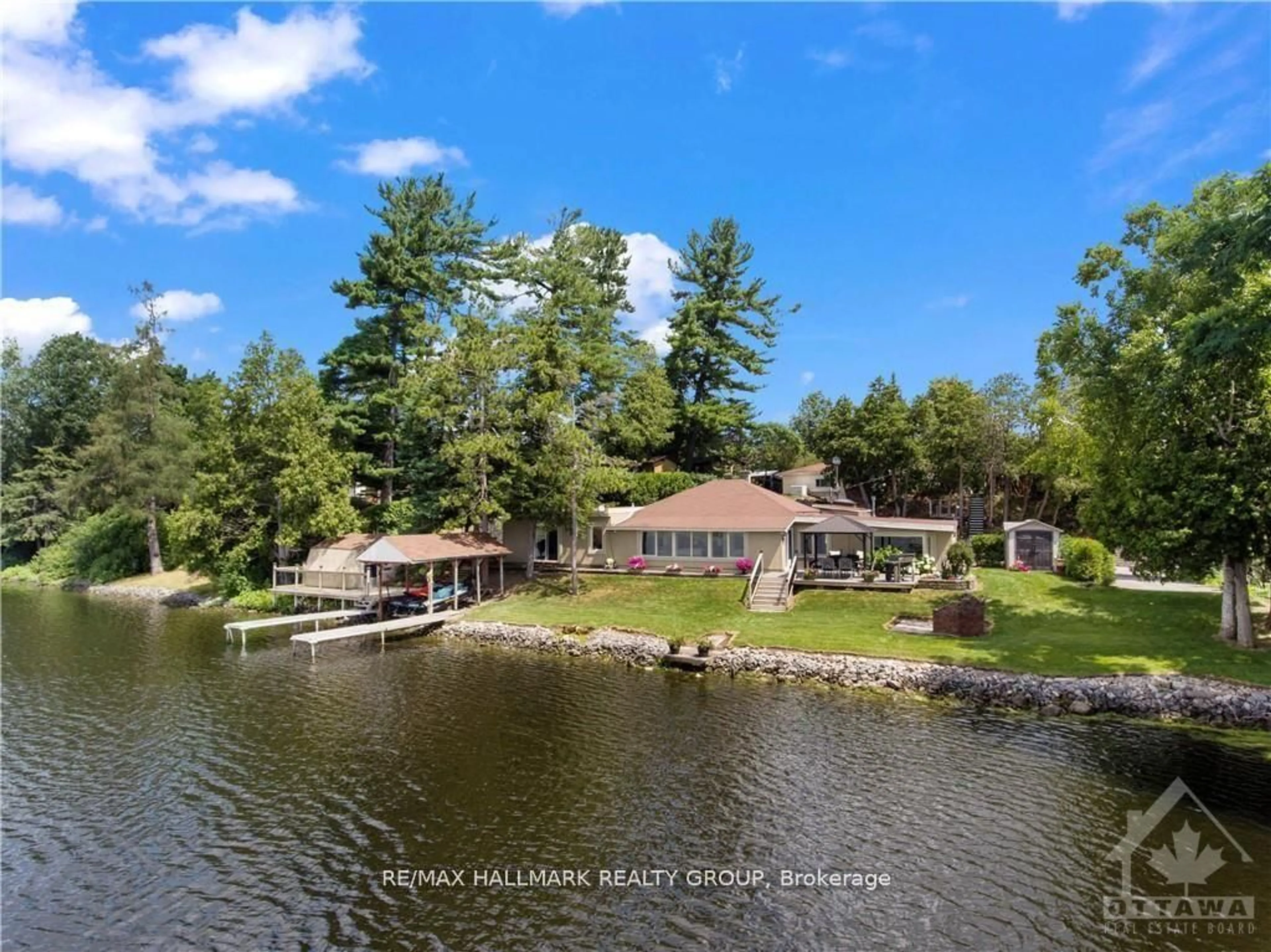 A pic from outside/outdoor area/front of a property/back of a property/a pic from drone, water/lake/river/ocean view for 3332 RIVER Rd #D, Ottawa Ontario K4M 1B4