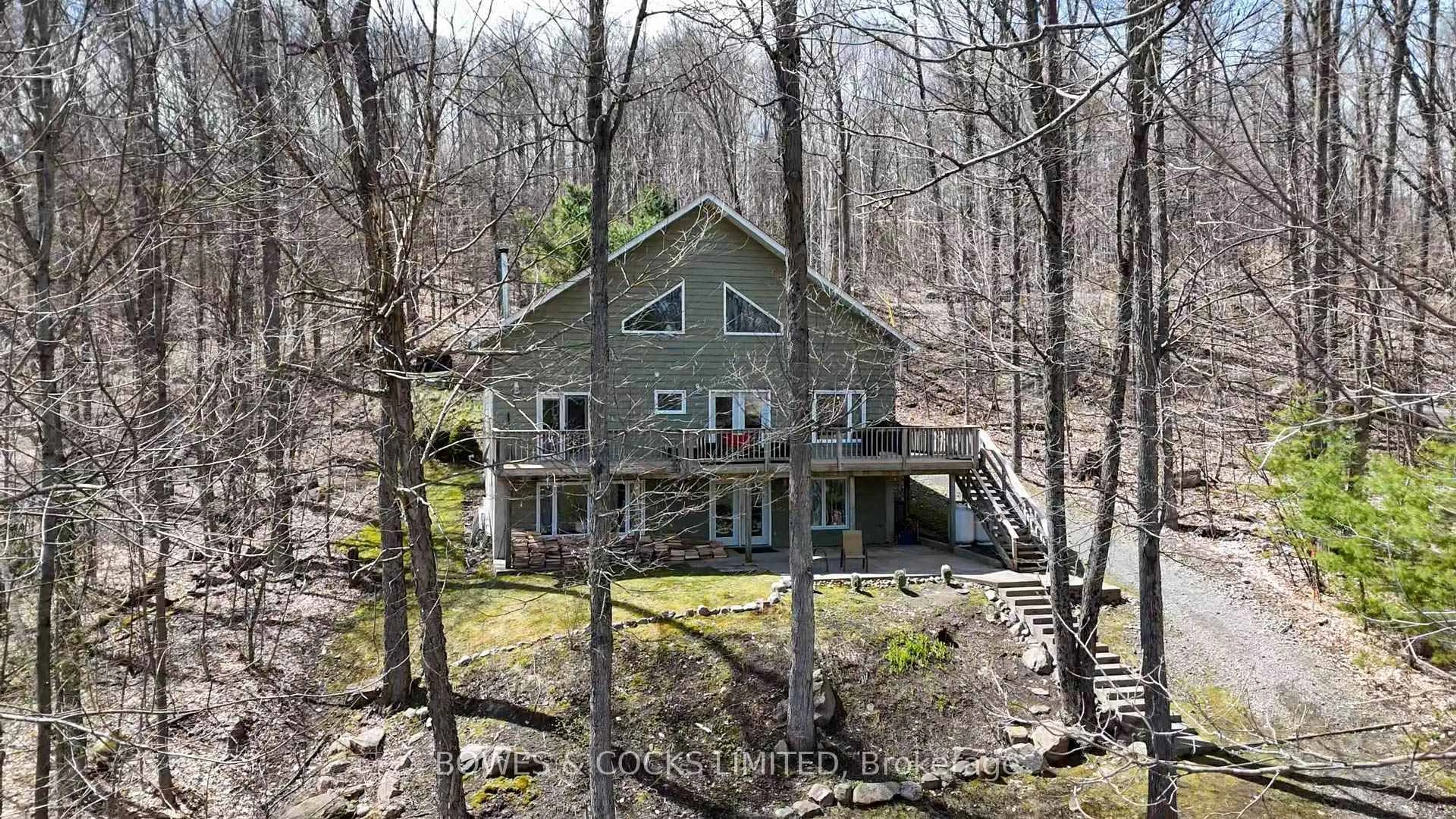 A pic from outside/outdoor area/front of a property/back of a property/a pic from drone, water/lake/river/ocean view for 451 West Diamond Lake Rd, Haliburton Ontario K0L 2A0