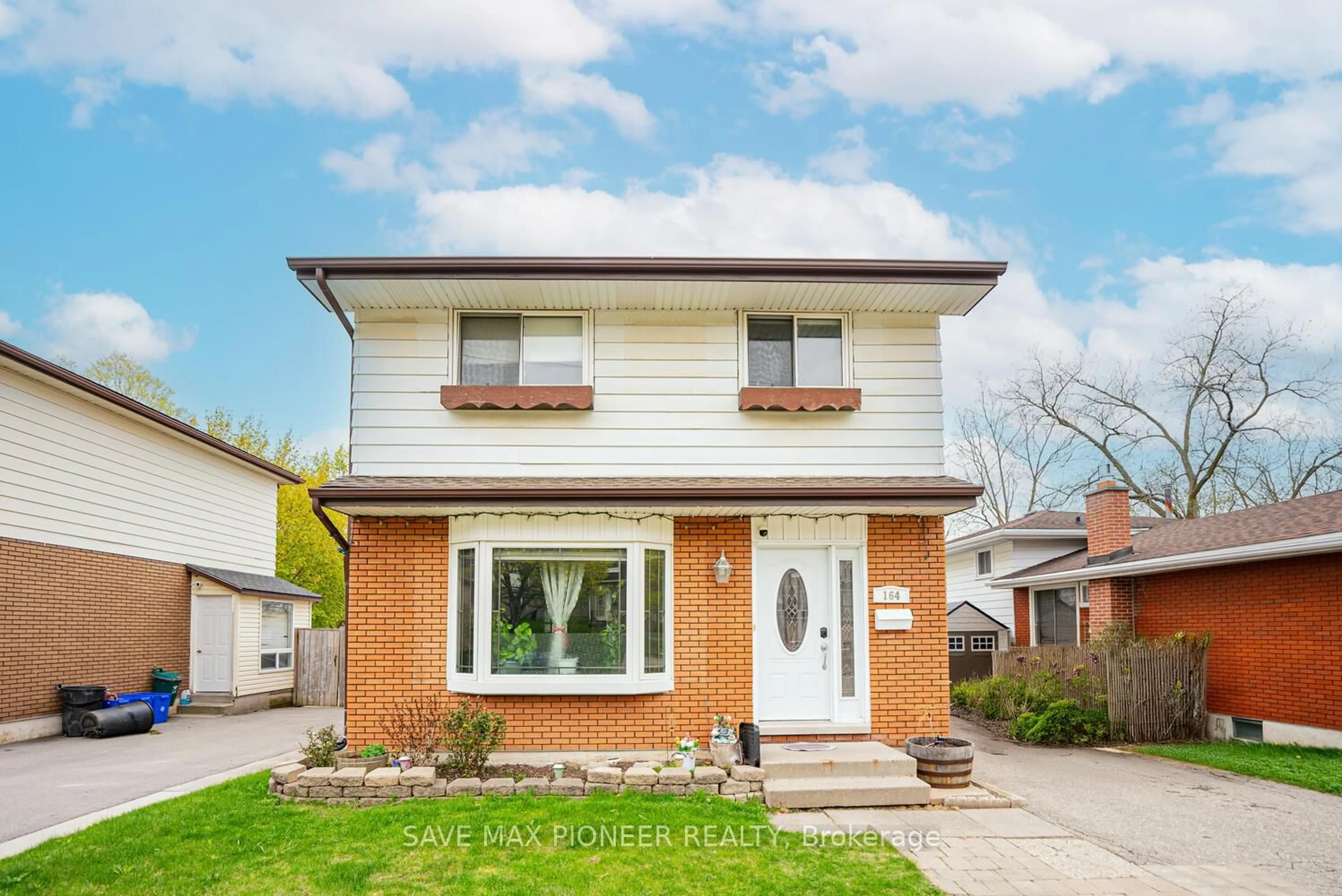 Home with brick exterior material, street for 164 Green Valley Dr, Kitchener Ontario N2P 1C4