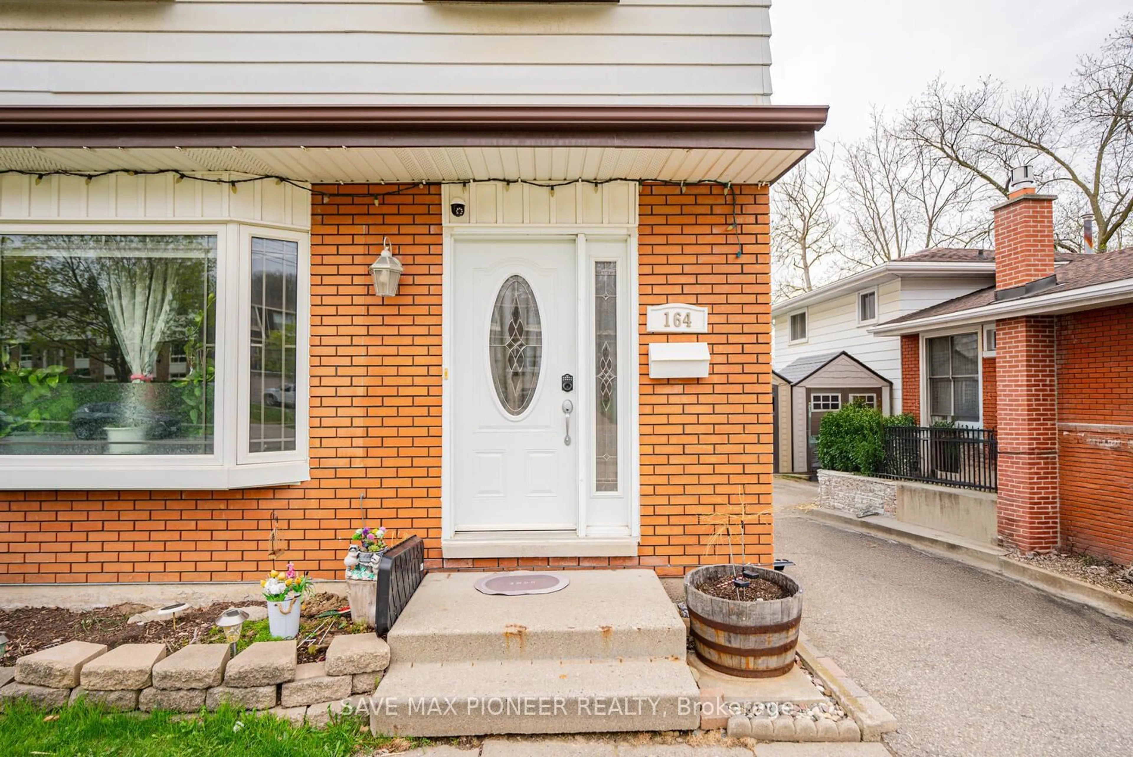 Home with brick exterior material, street for 164 Green Valley Dr, Kitchener Ontario N2P 1C4