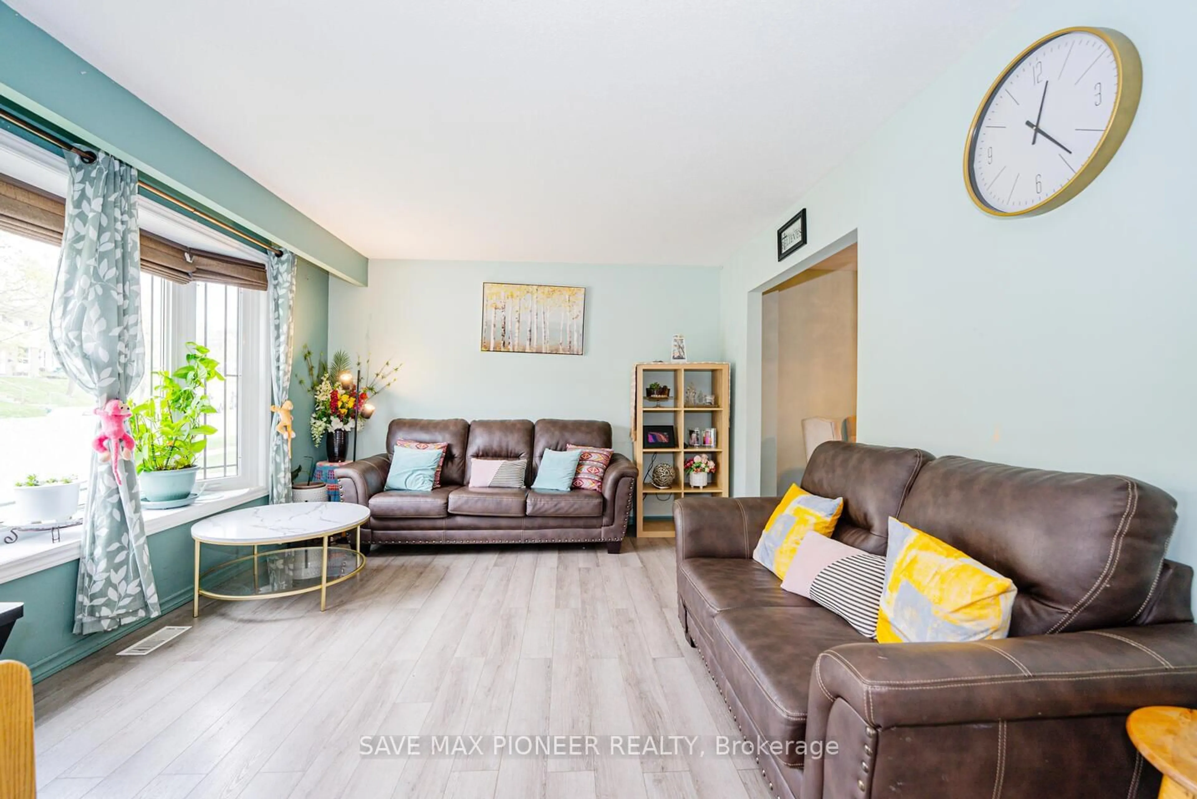 Living room with furniture, wood/laminate floor for 164 Green Valley Dr, Kitchener Ontario N2P 1C4