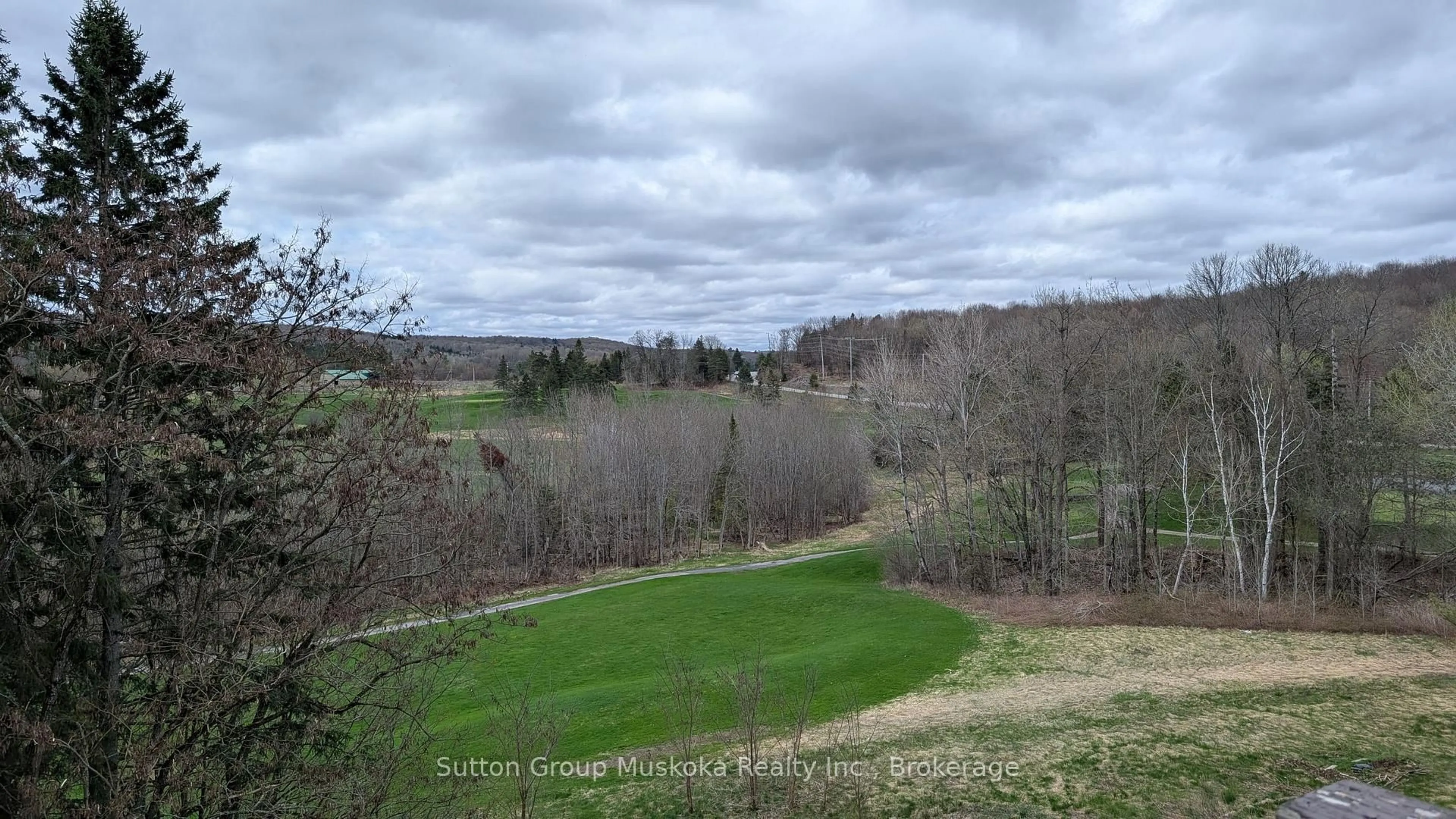 A pic from outside/outdoor area/front of a property/back of a property/a pic from drone, forest/trees view for 1235 Deerhurst Dr #53-303, Huntsville Ontario P1H 2E8