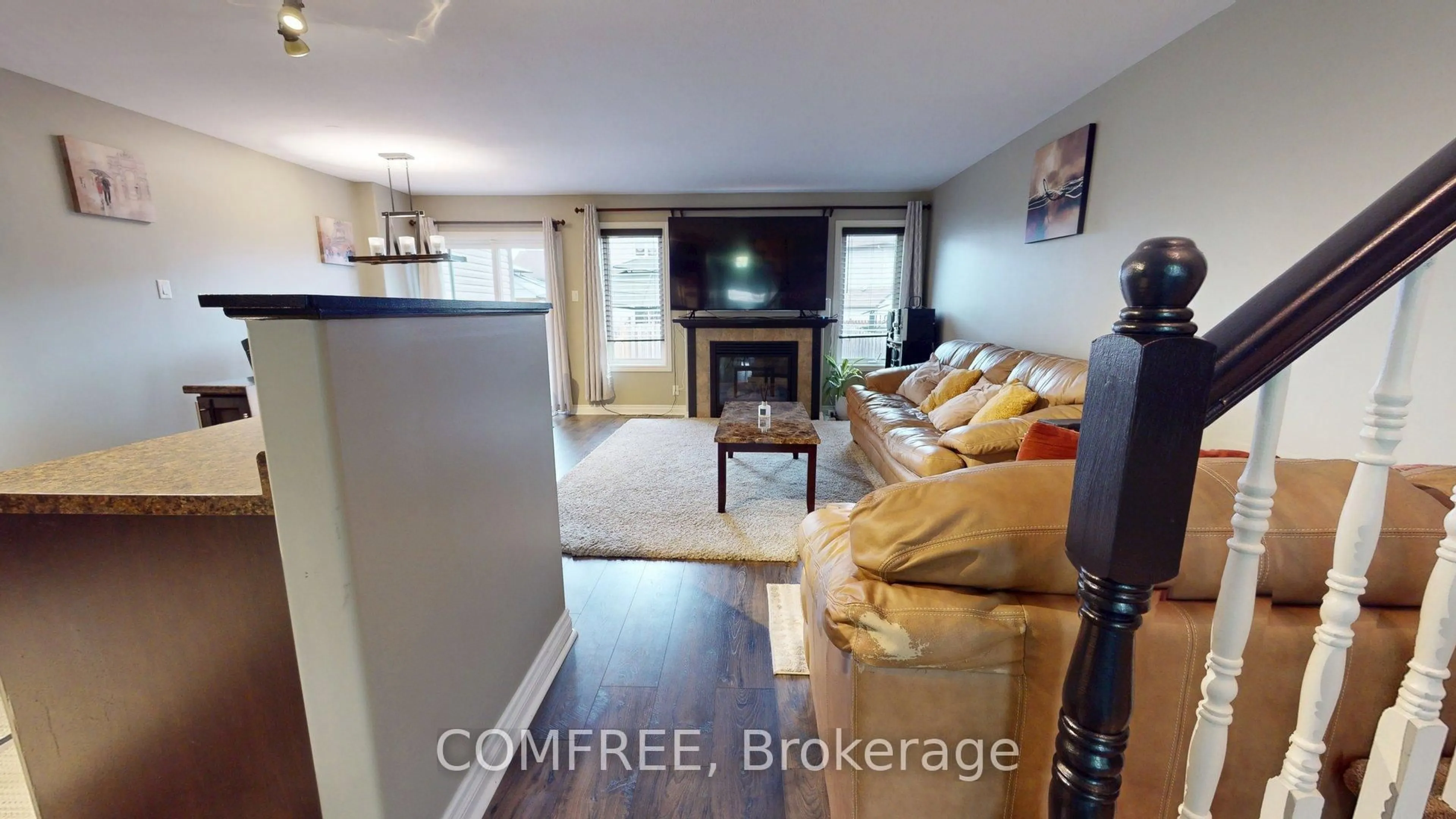 Living room with furniture, wood/laminate floor for 962 Linaria Walk, Ottawa Ontario K4A 0H9