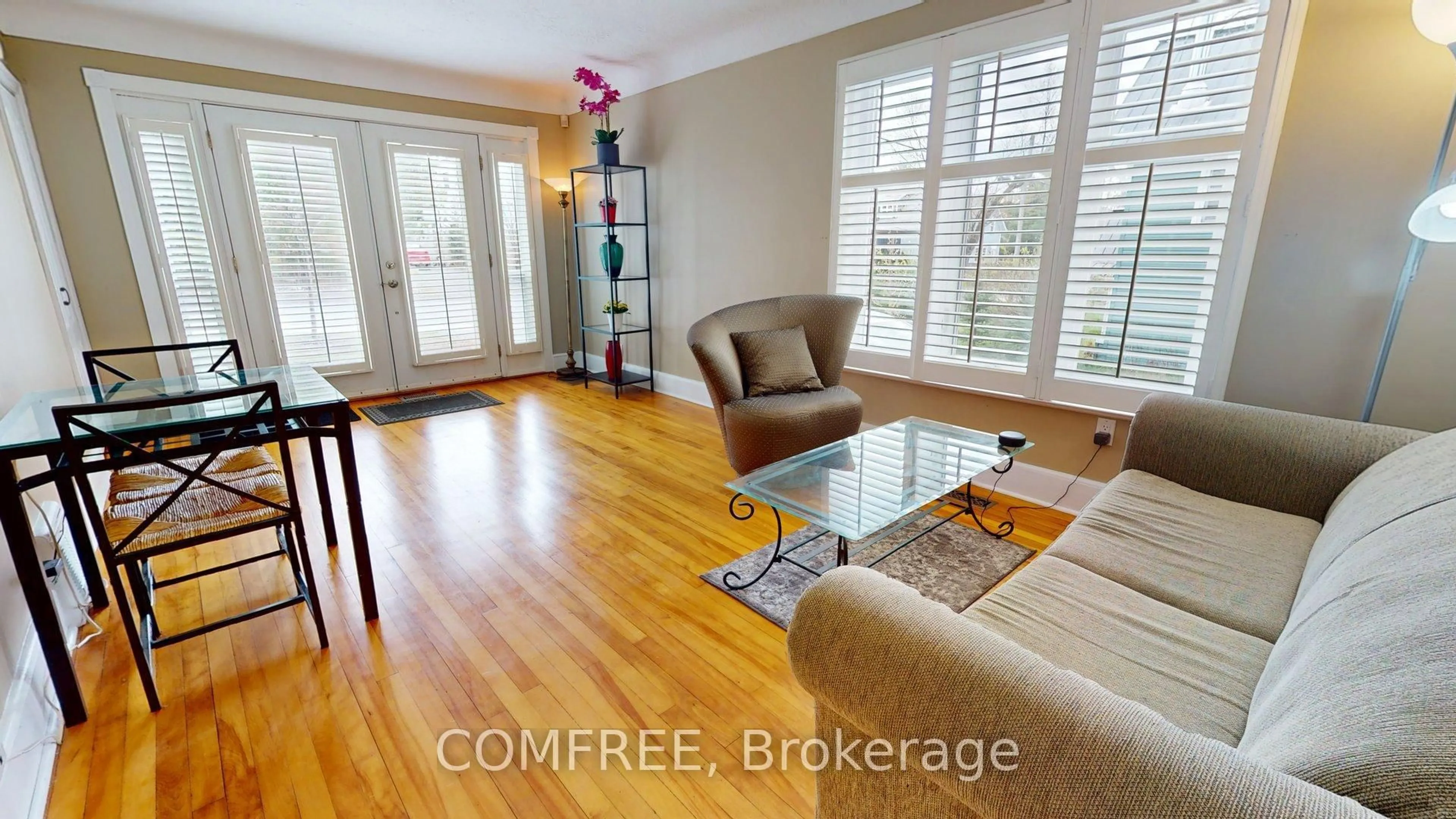 Living room with furniture, wood/laminate floor for 180 Britannia Rd, Ottawa Ontario K2B 5W9