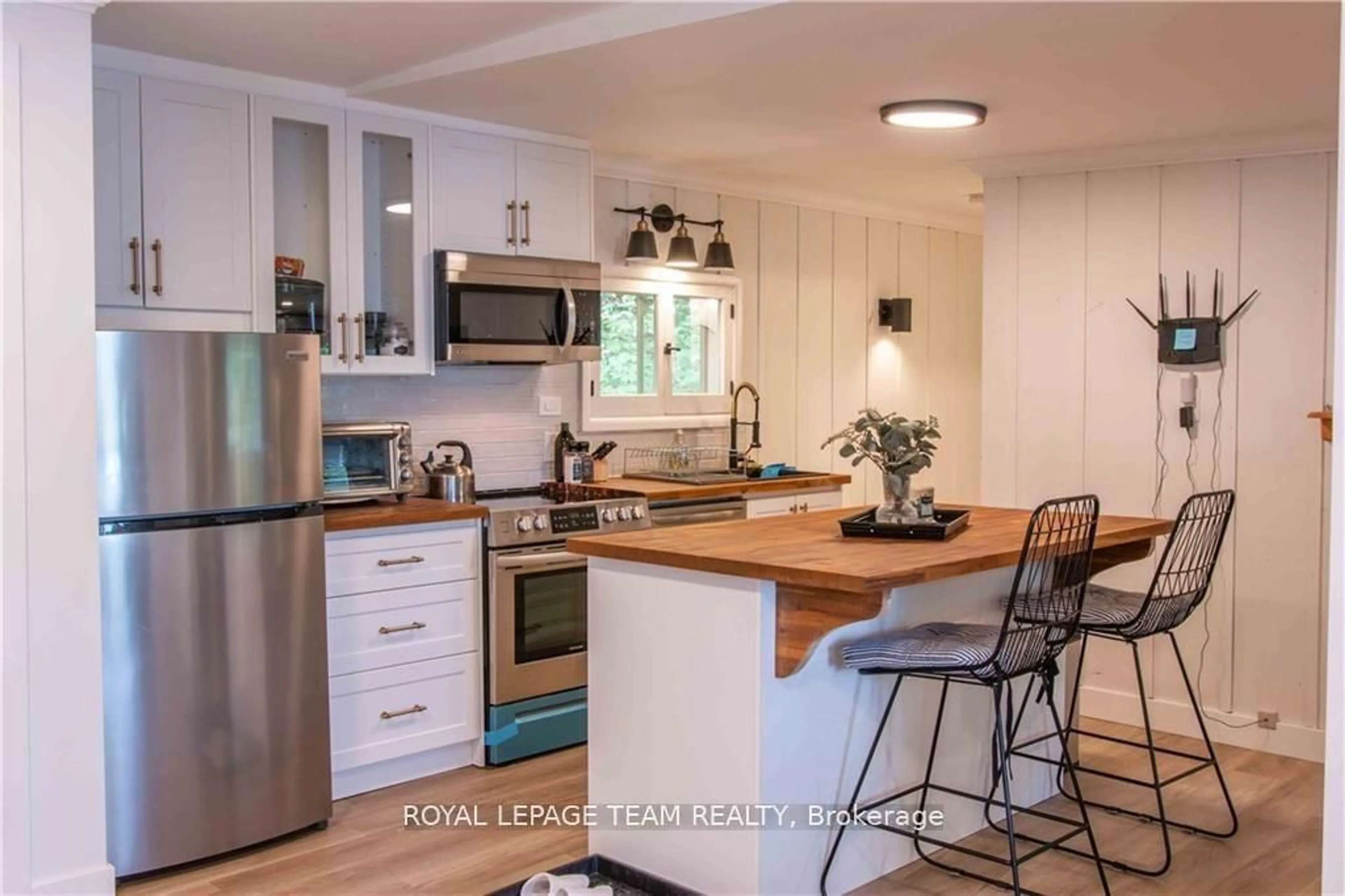 Open concept kitchen, wood/laminate floor for 242 Chanonhouse Rd, Barry's Bay Ontario K0J 1B0