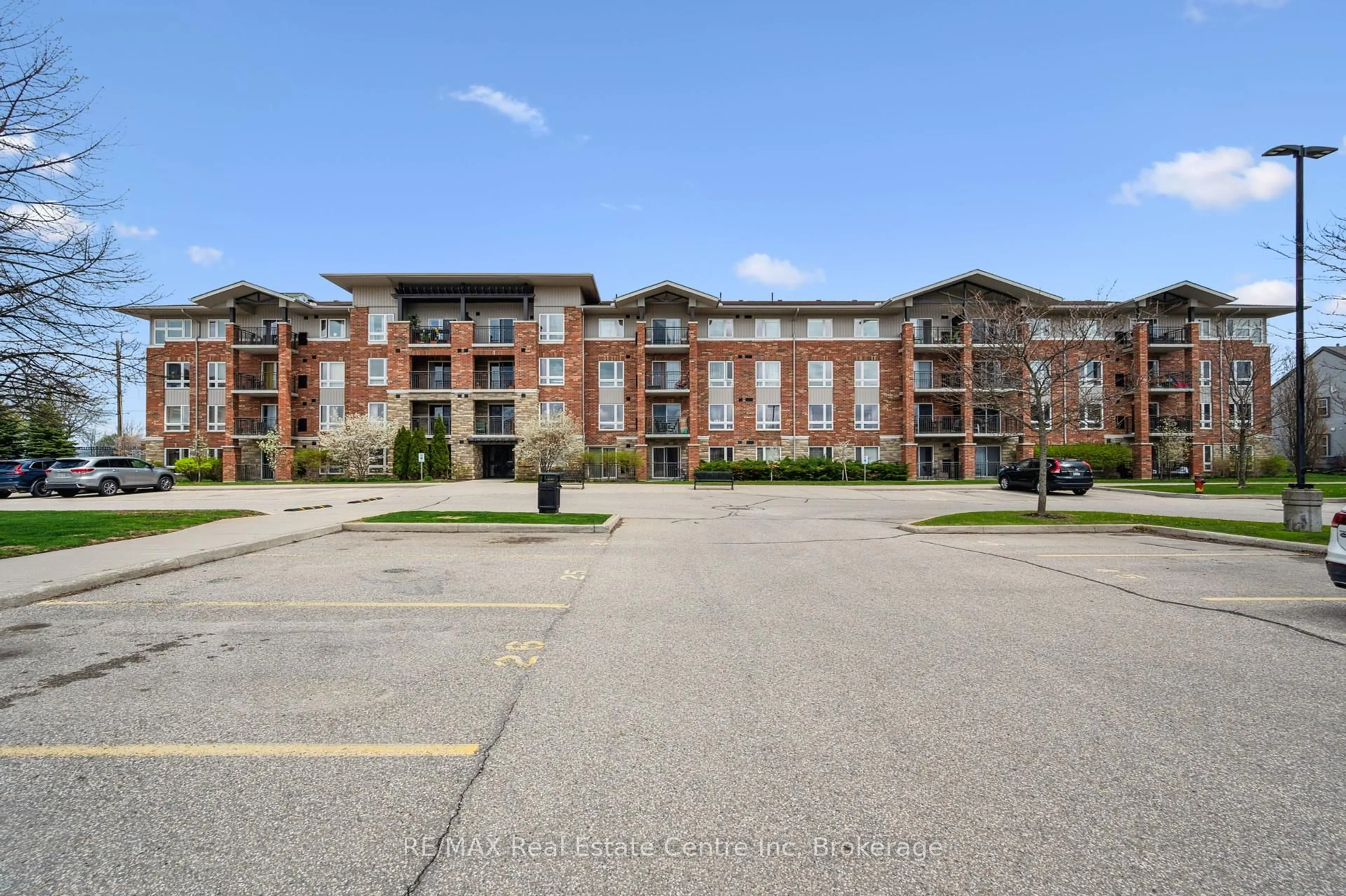 A pic from outside/outdoor area/front of a property/back of a property/a pic from drone, building for 19 Waterford Dr #303, Guelph Ontario N1L 0G8