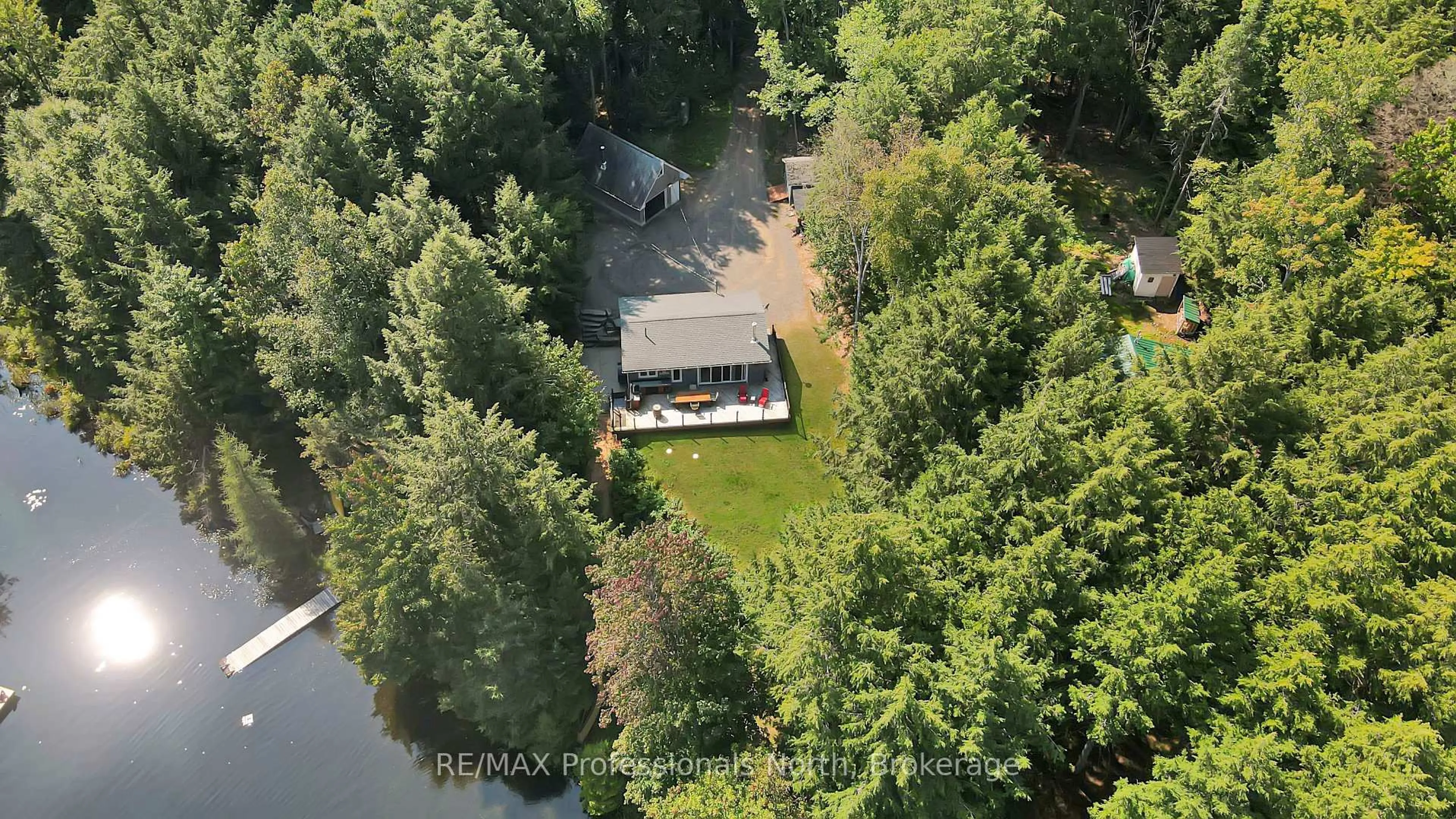 A pic from outside/outdoor area/front of a property/back of a property/a pic from drone, water/lake/river/ocean view for 1192 Charlie George Lake Dr, Dysart et al Ontario K0L 1X0