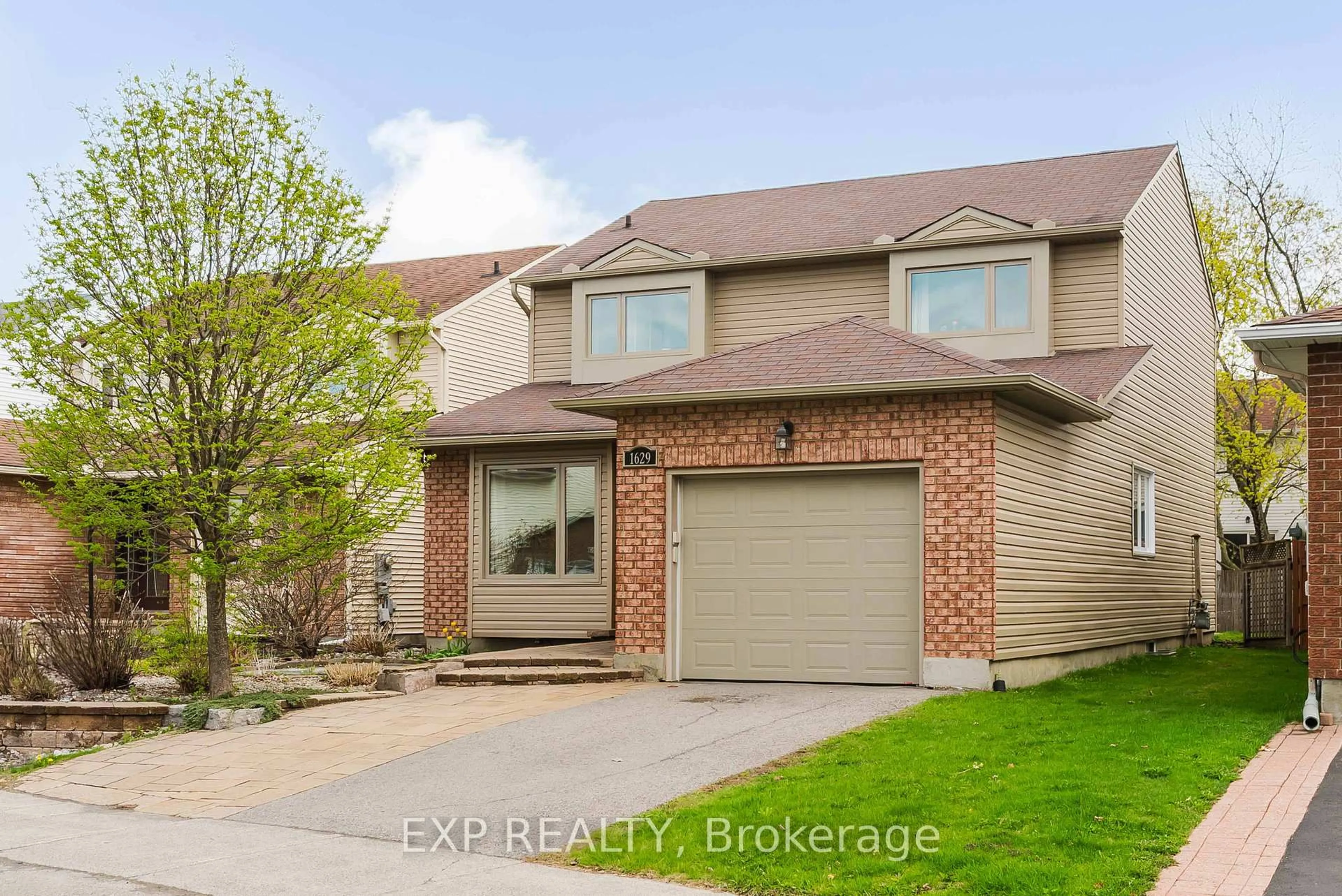 Home with brick exterior material, street for 1629 Champneuf Dr, Ottawa Ontario K1C 6C1