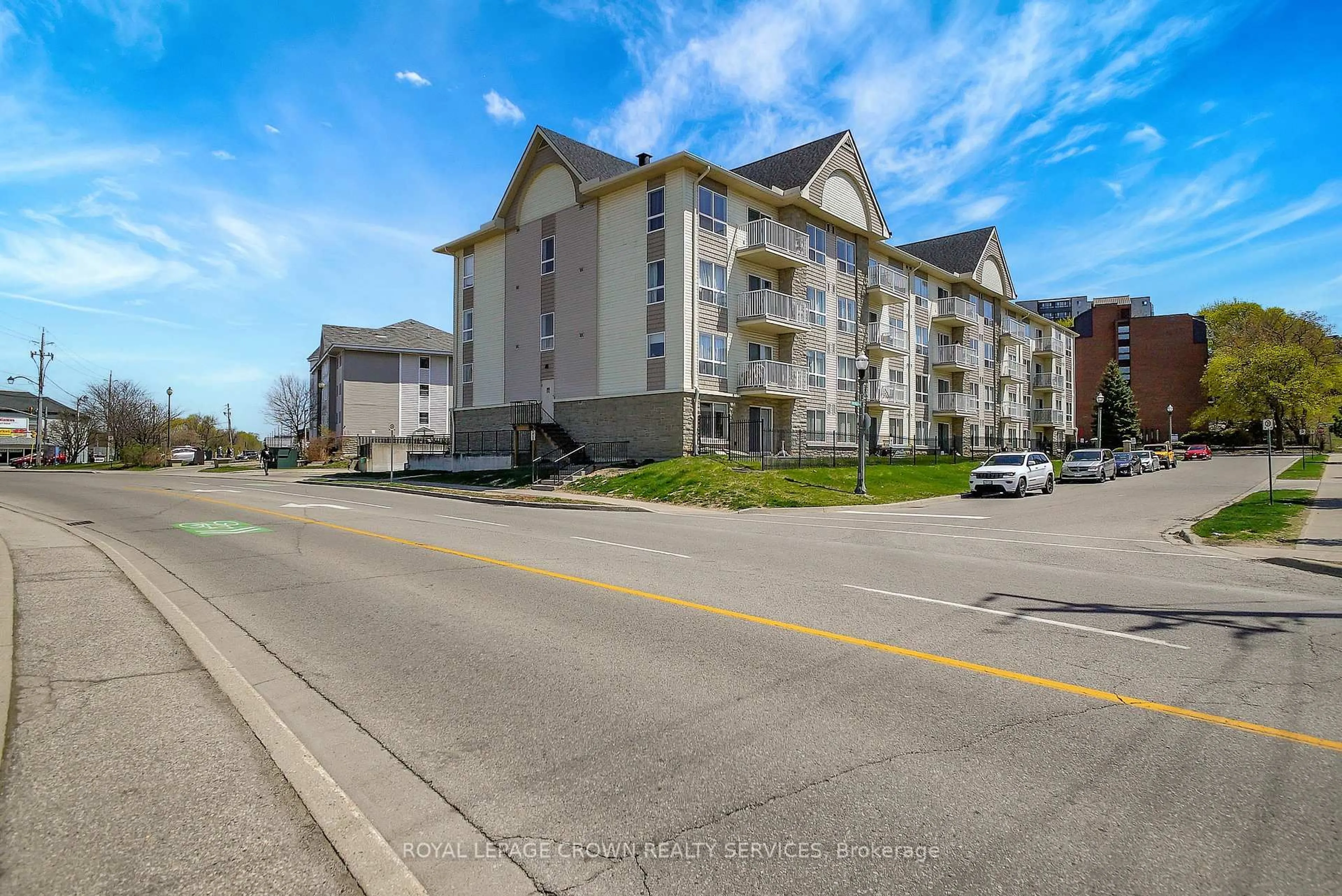 A pic from outside/outdoor area/front of a property/back of a property/a pic from drone, street for 8 Harris St #203, Cambridge Ontario N1R 8R1