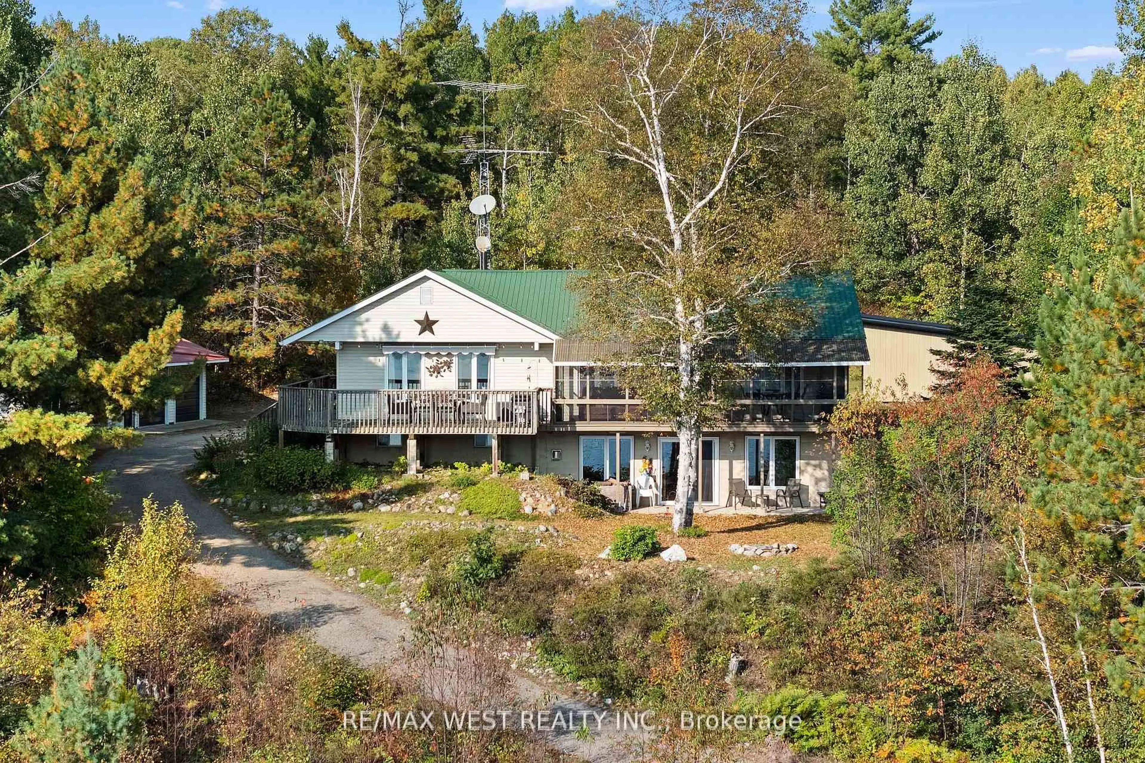 A pic from outside/outdoor area/front of a property/back of a property/a pic from drone, water/lake/river/ocean view for 558 Mccauley Lake Rd, South Algonquin Ontario K0J 2C0