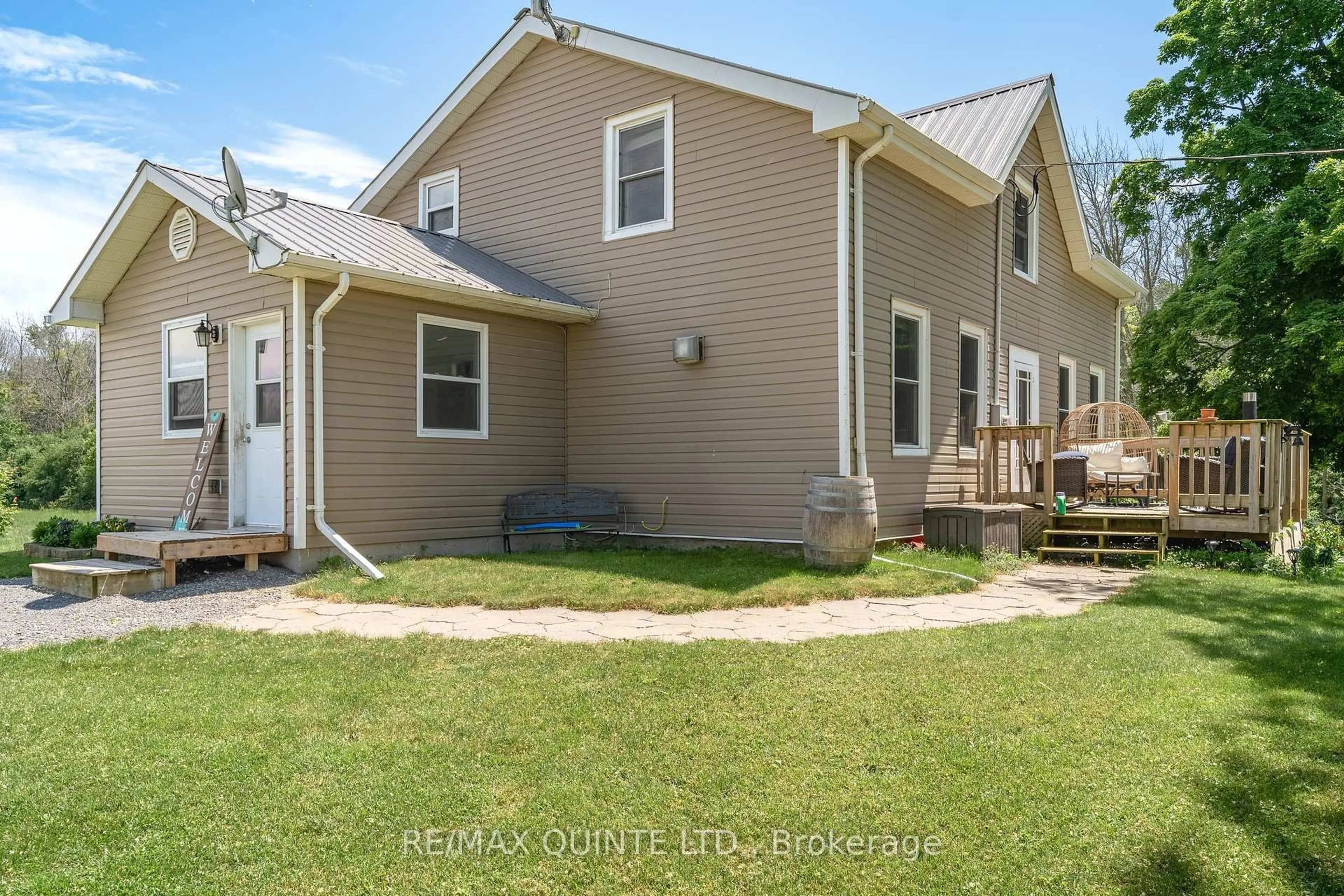Home with vinyl exterior material, street for 2 Baitleys Rd, Prince Edward County Ontario K0K 3L0
