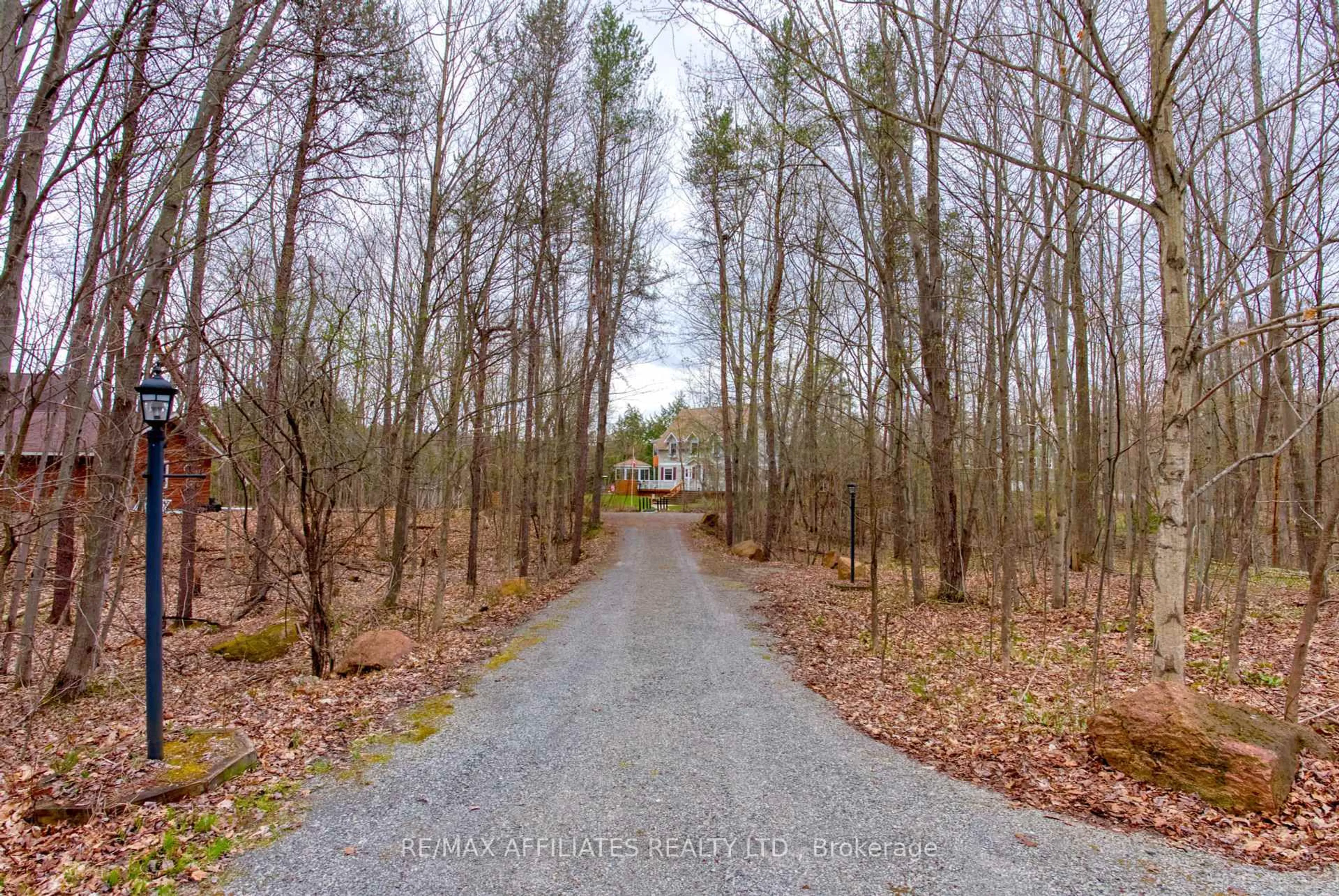 A pic from outside/outdoor area/front of a property/back of a property/a pic from drone, forest/trees view for 133 Swan Lane, Rideau Lakes Ontario K0G 1V0