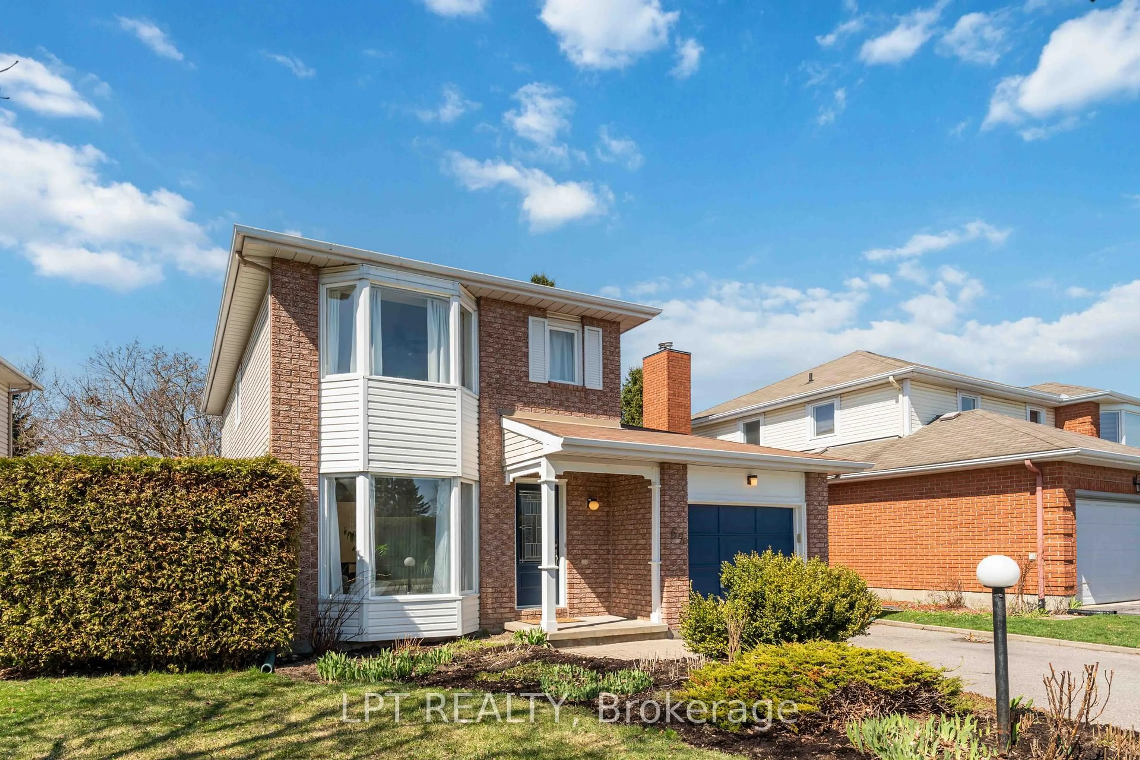 Home with brick exterior material, street for 62 TARTAN Dr, Barrhaven Ontario K2J 2V5