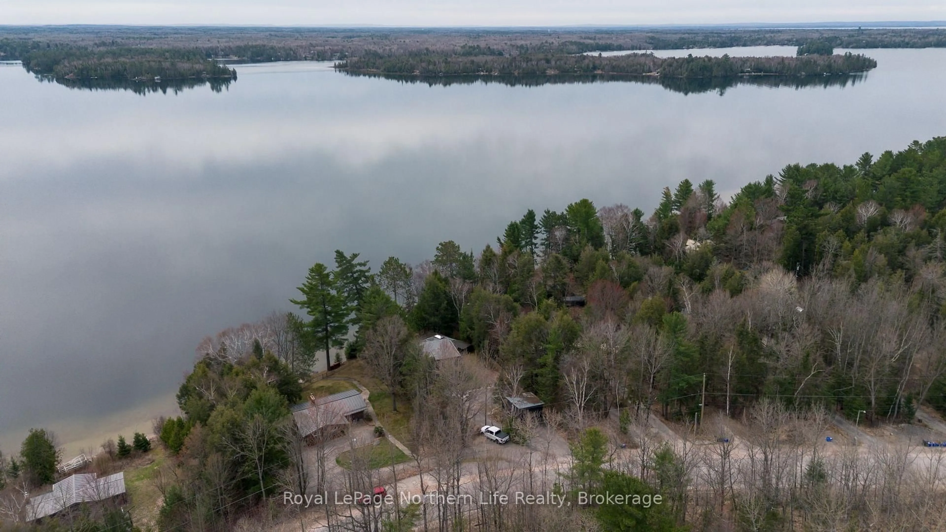 A pic from outside/outdoor area/front of a property/back of a property/a pic from drone, water/lake/river/ocean view for 126 Silver Lady Lane, North Bay Ontario P1B 8G4