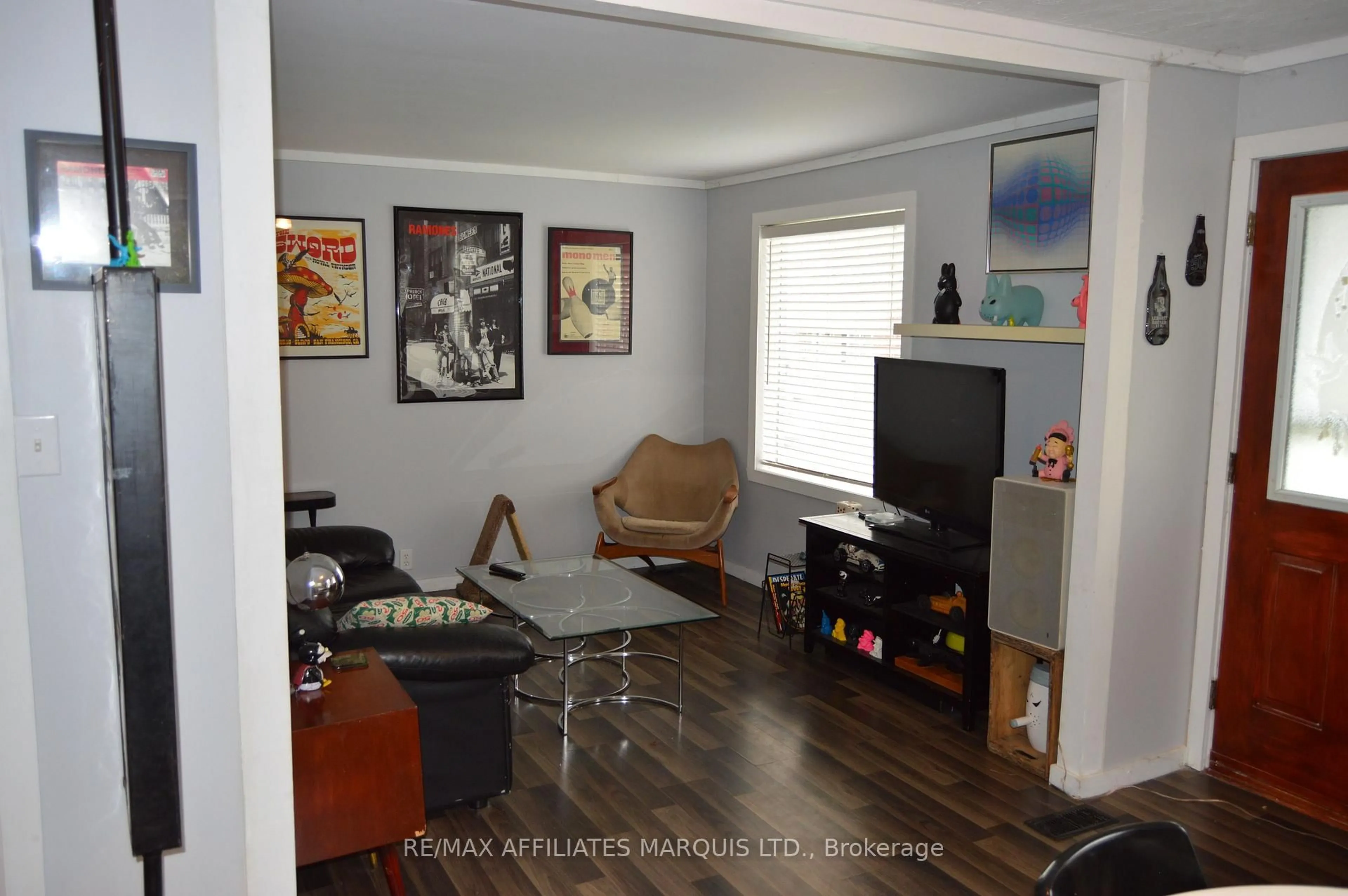 Living room with furniture, wood/laminate floor for 440 Eighth St, Cornwall Ontario K6H 2T2
