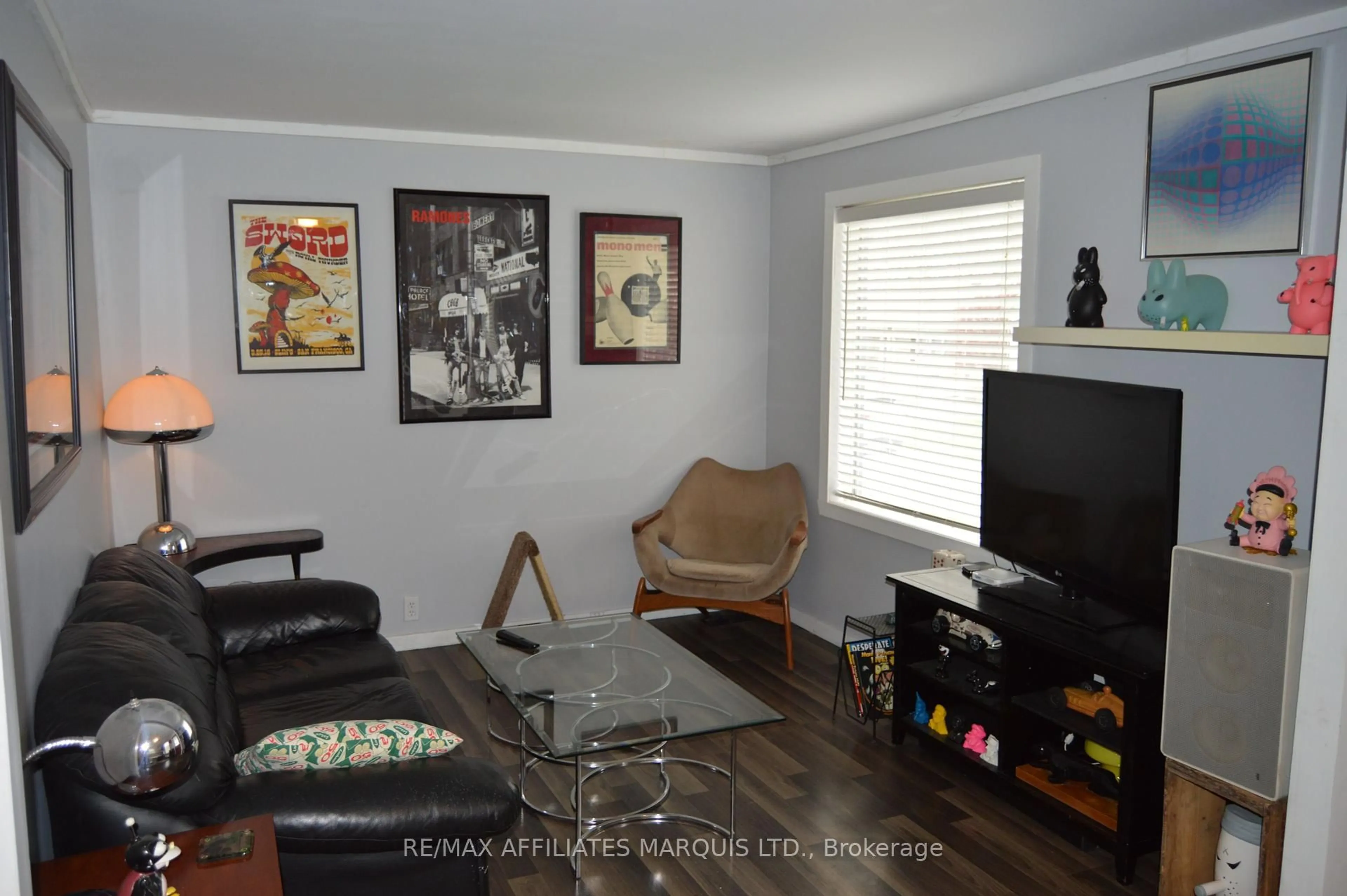 Living room with furniture, wood/laminate floor for 440 Eighth St, Cornwall Ontario K6H 2T2