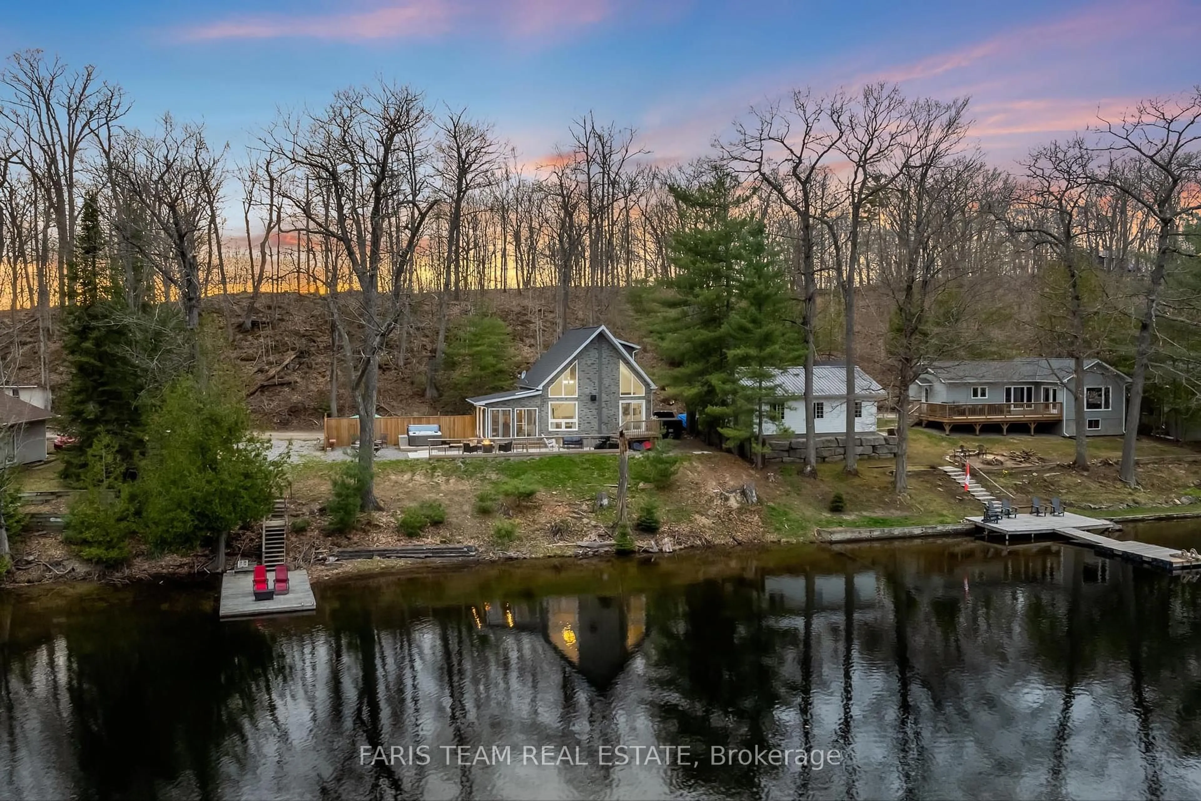 A pic from outside/outdoor area/front of a property/back of a property/a pic from drone, water/lake/river/ocean view for 1036 Beverley Lane, Minden Hills Ontario K0M 2L1