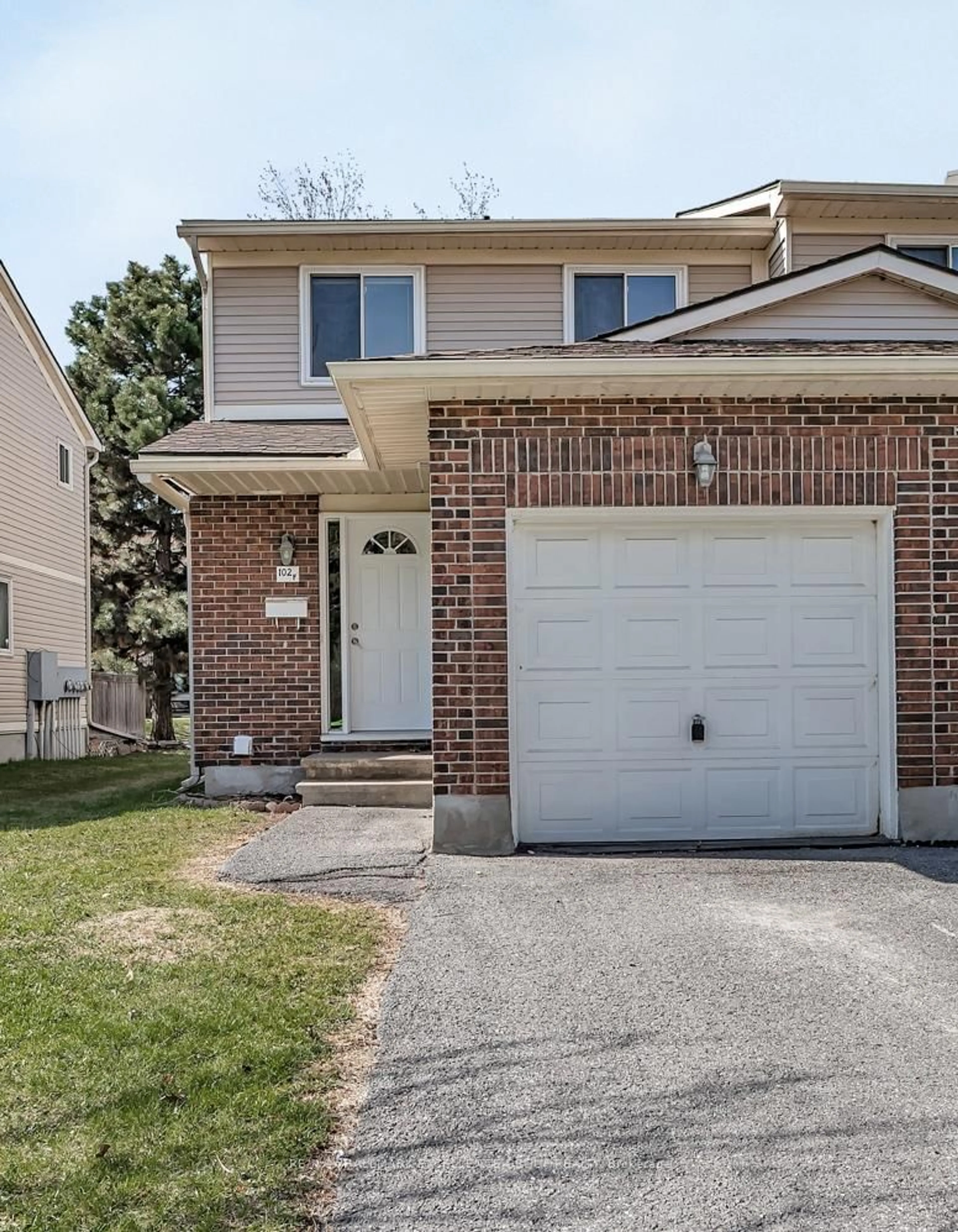 Home with brick exterior material, street for 102F Valley Stream Dr, Ottawa Ontario K2H 9E1