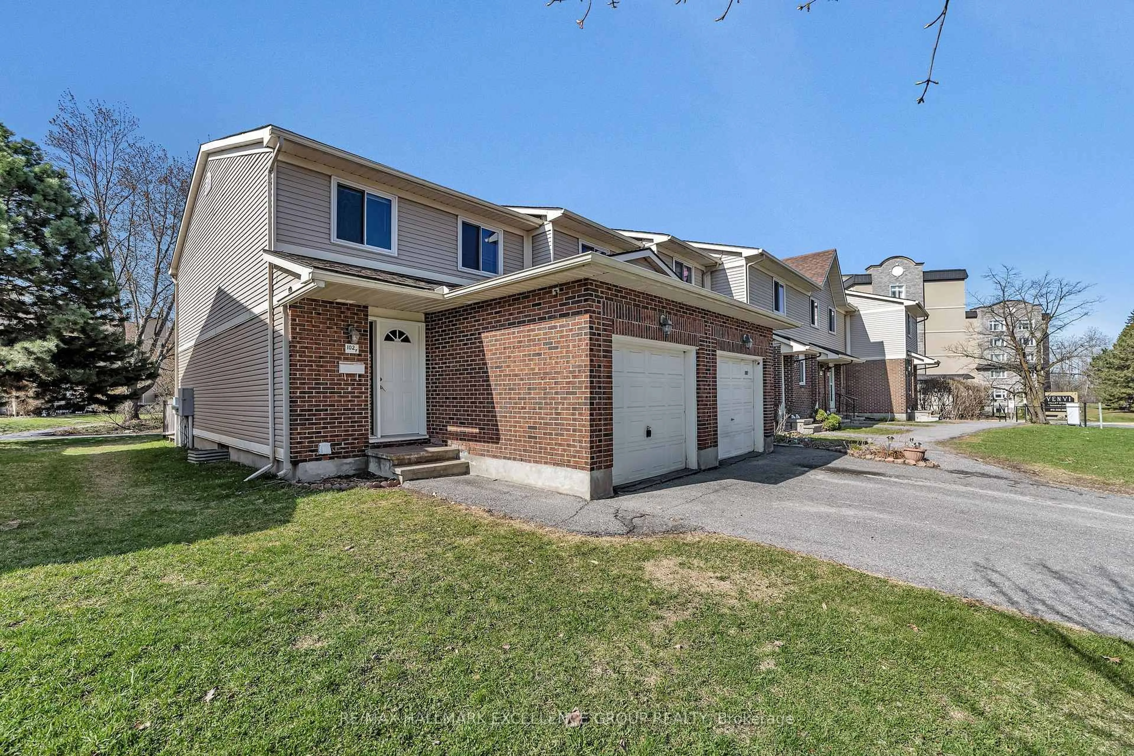 Home with brick exterior material, street for 102F Valley Stream Dr, Ottawa Ontario K2H 9E1