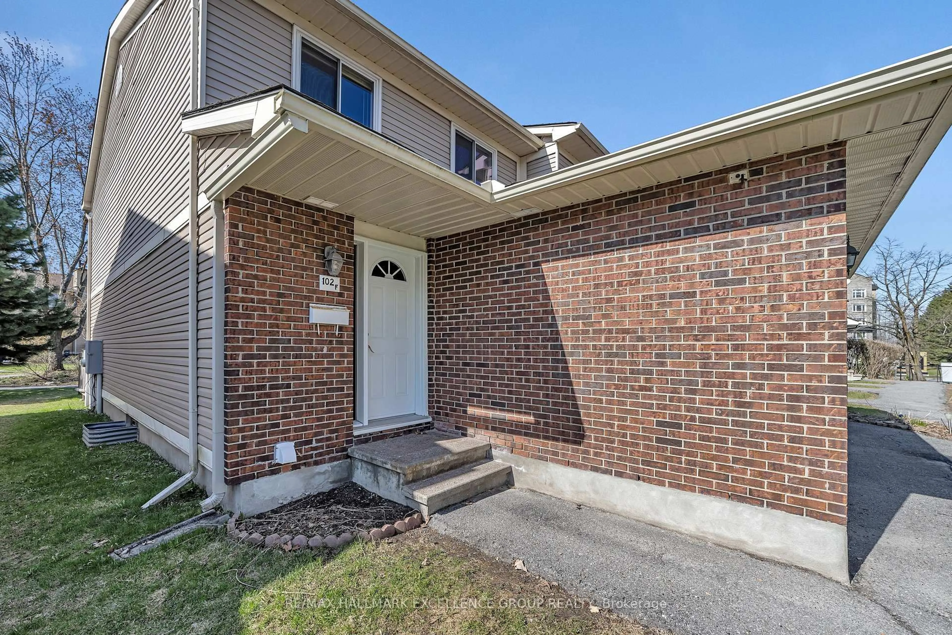 Home with brick exterior material, street for 102F Valley Stream Dr, Ottawa Ontario K2H 9E1