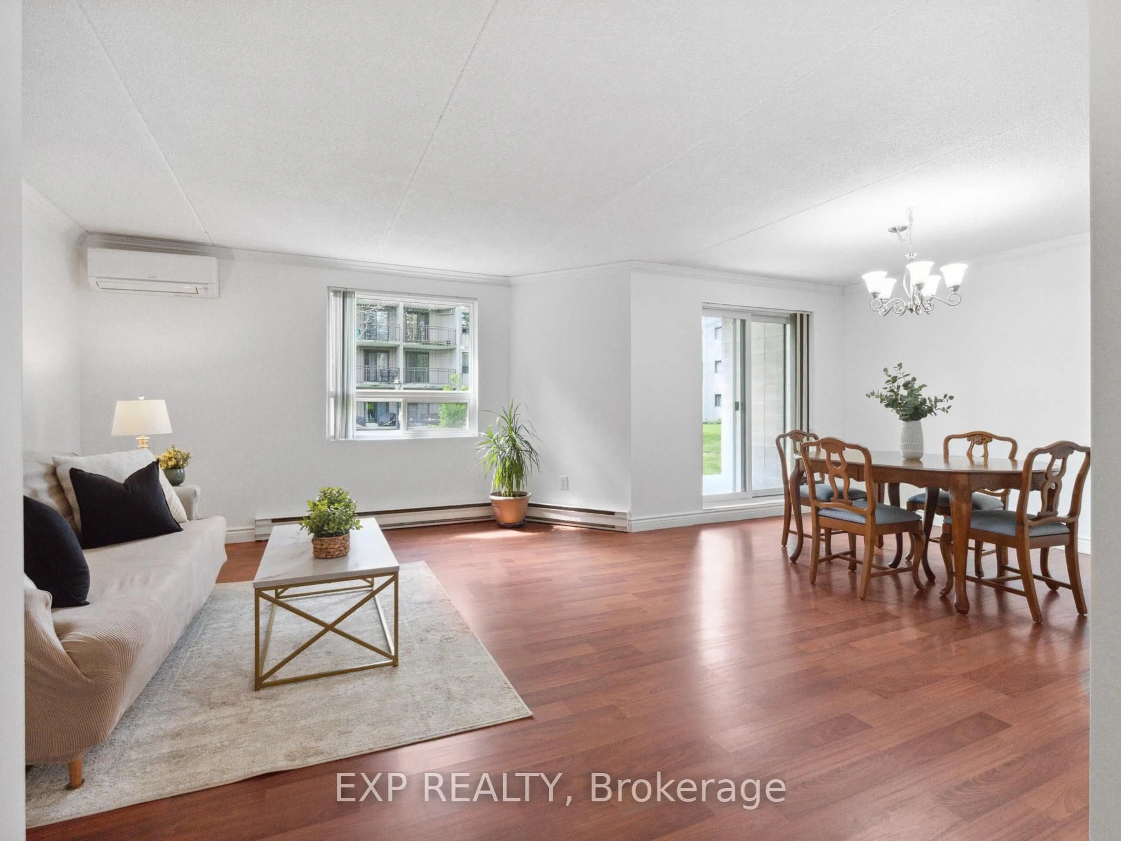 Living room with furniture, wood/laminate floor for 4658 DRUMMOND Rd #126, Niagara Falls Ontario L2E 7E1