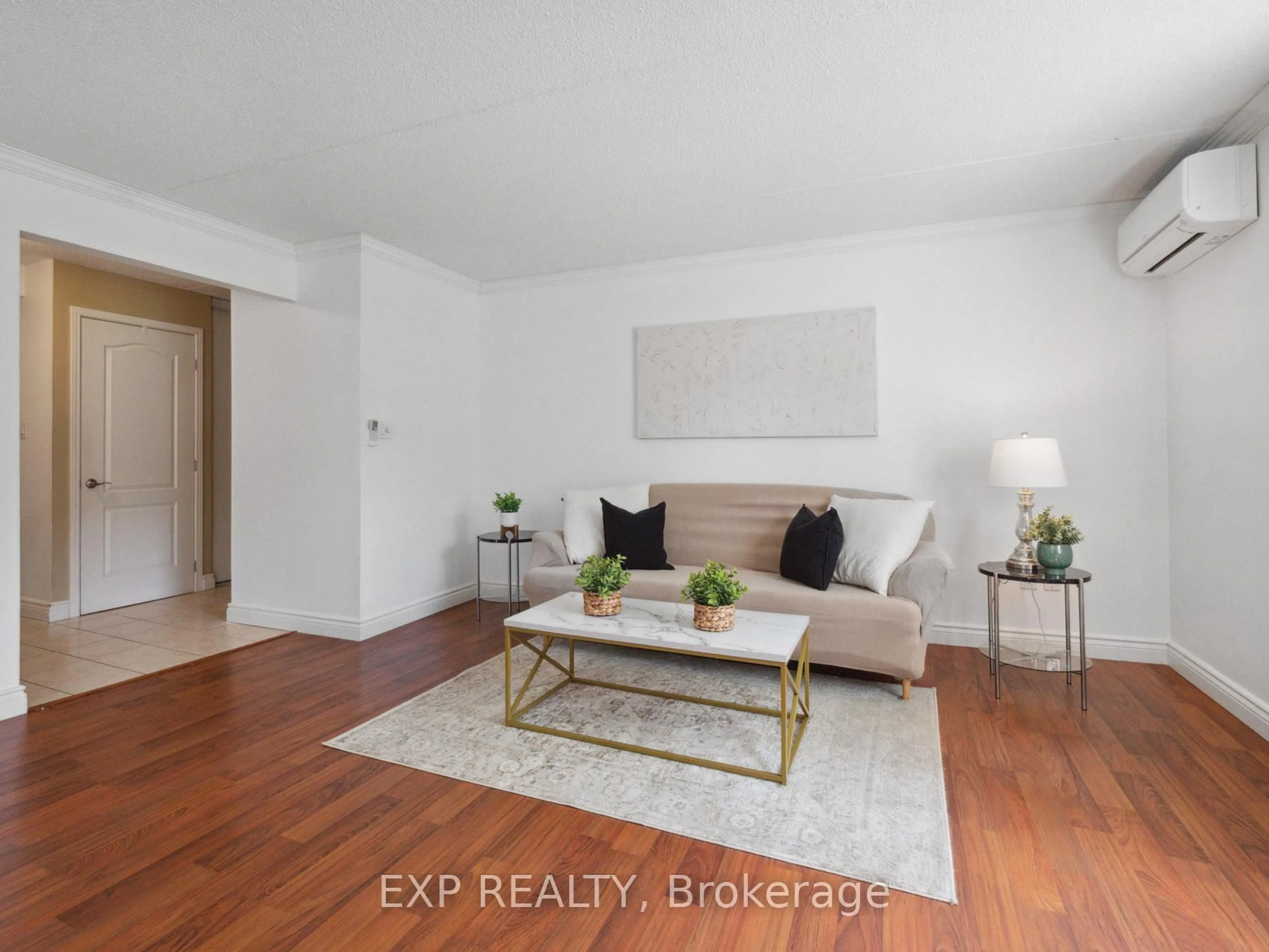 Living room with furniture, wood/laminate floor for 4658 DRUMMOND Rd #126, Niagara Falls Ontario L2E 7E1