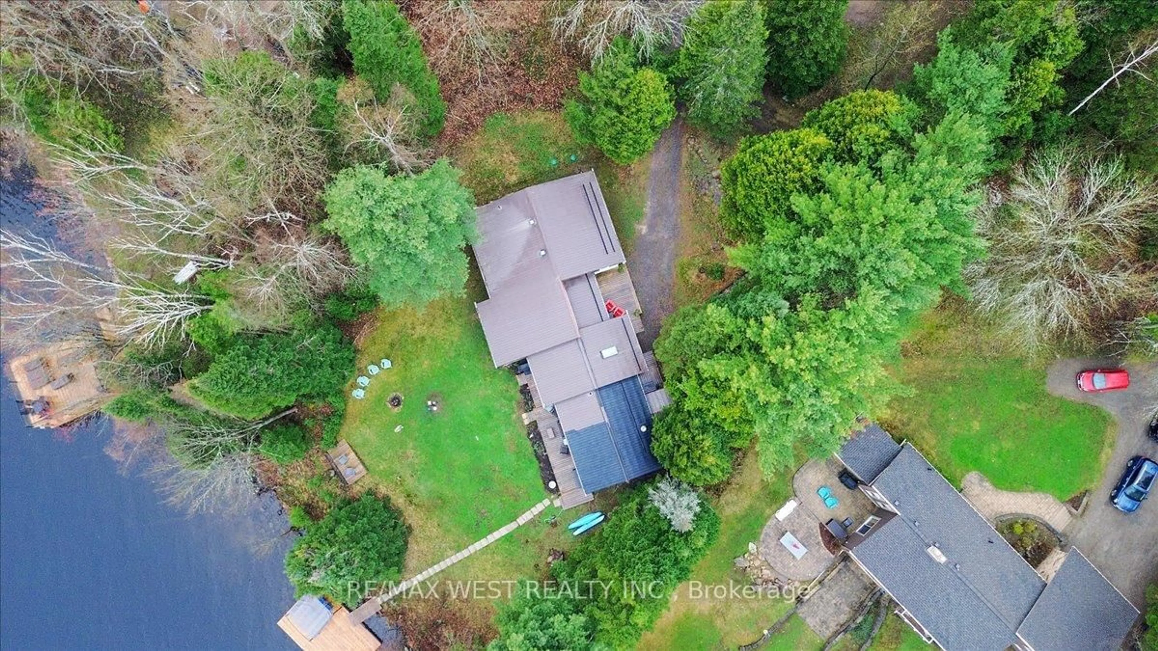 A pic from outside/outdoor area/front of a property/back of a property/a pic from drone, street for 1017 Rays Lane, Minden Hills Ontario K0M 2K0