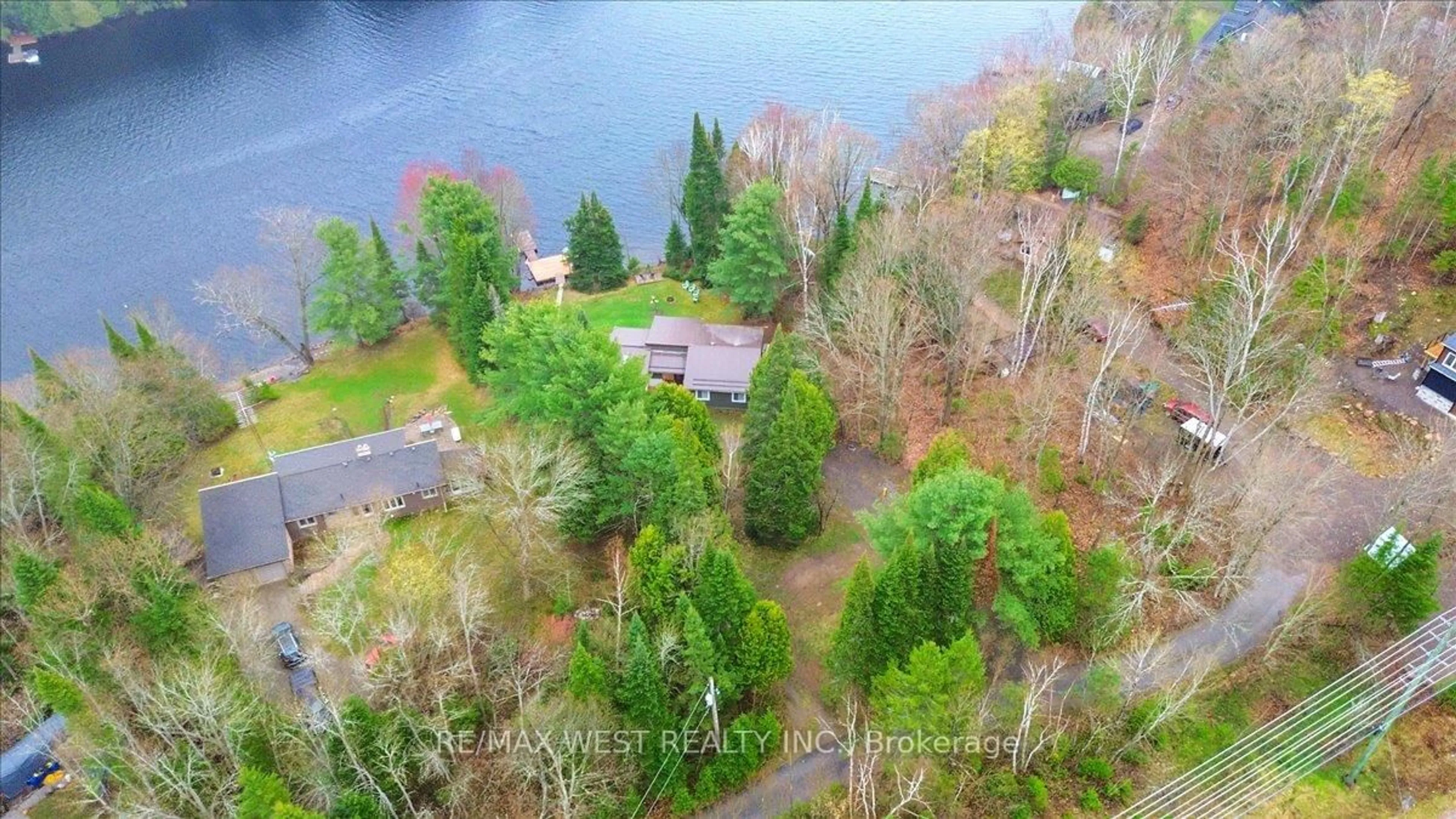 A pic from outside/outdoor area/front of a property/back of a property/a pic from drone, water/lake/river/ocean view for 1017 Rays Lane, Minden Hills Ontario K0M 2K0