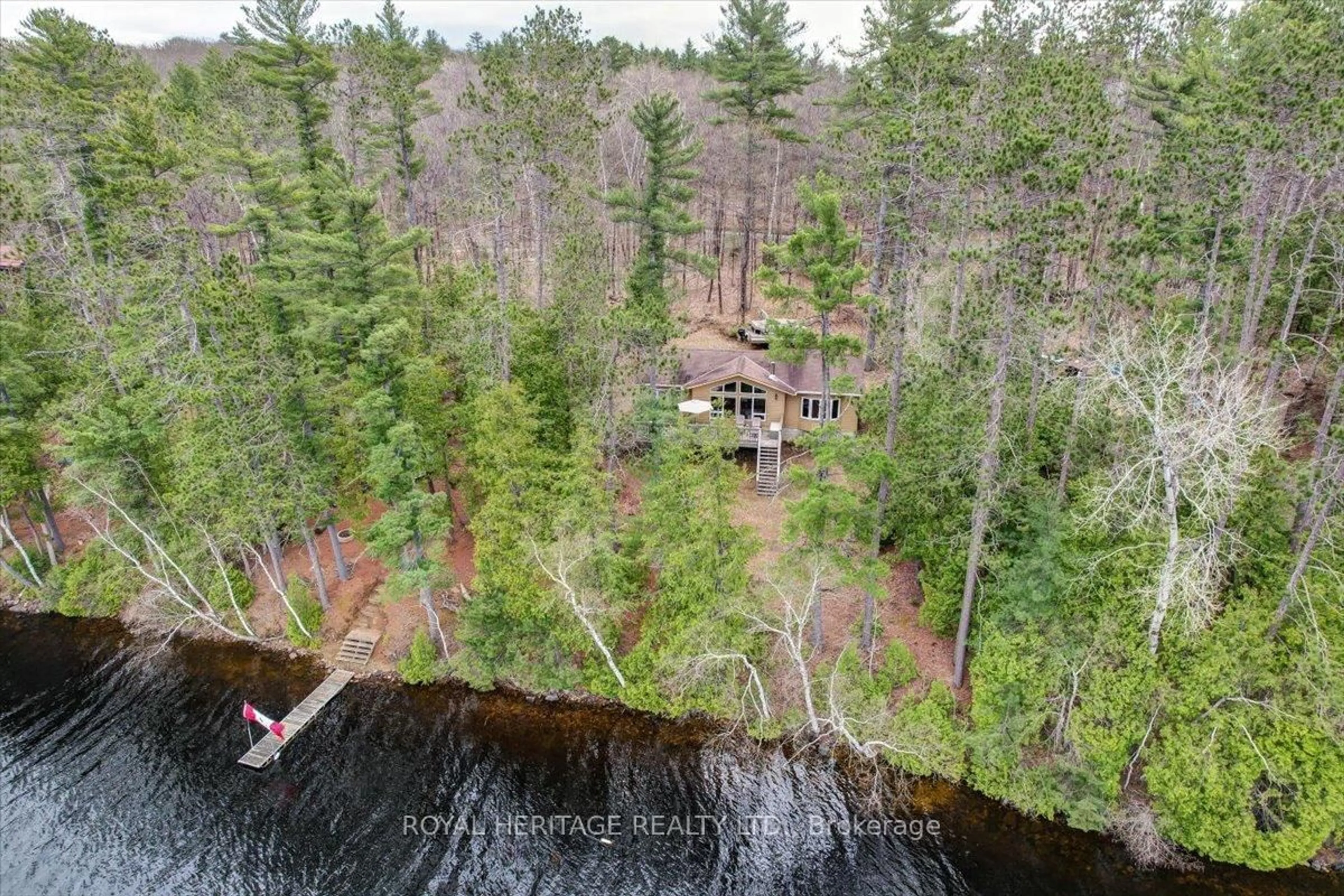 A pic from outside/outdoor area/front of a property/back of a property/a pic from drone, water/lake/river/ocean view for 2361B Shawenegog Lake Lane, Cloyne Ontario K0H 1K0