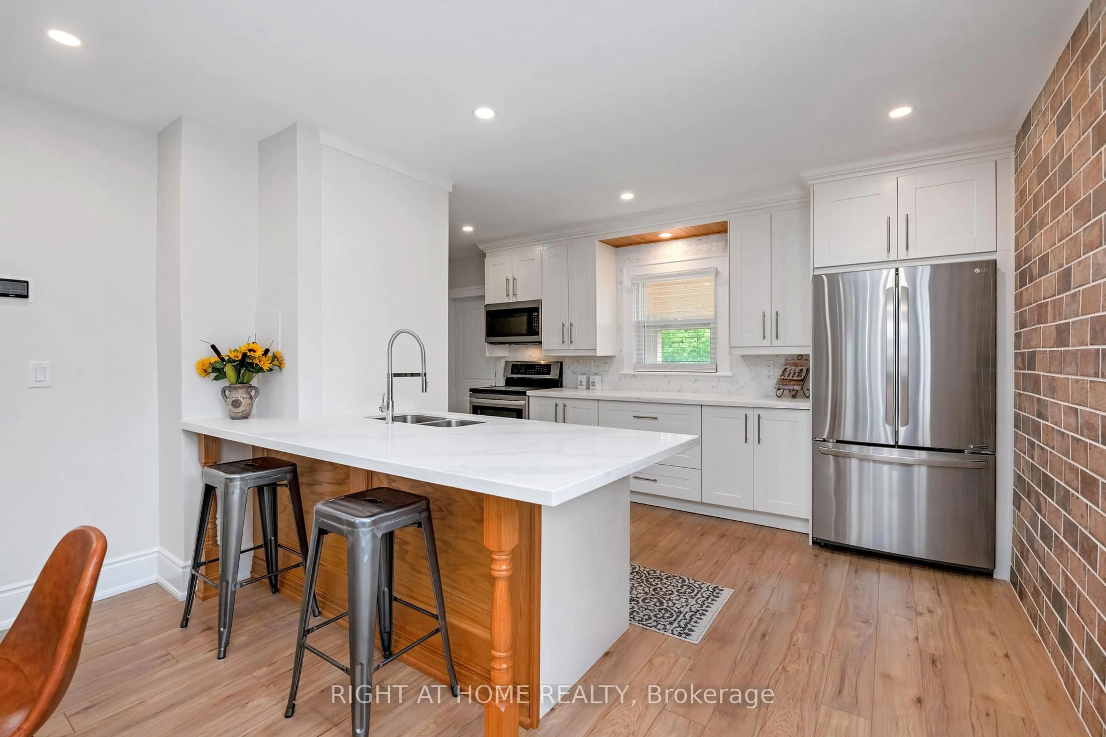 Open concept kitchen, wood/laminate floor for 1379-1381 Pierre Ave, Windsor Ontario N8X 4P2