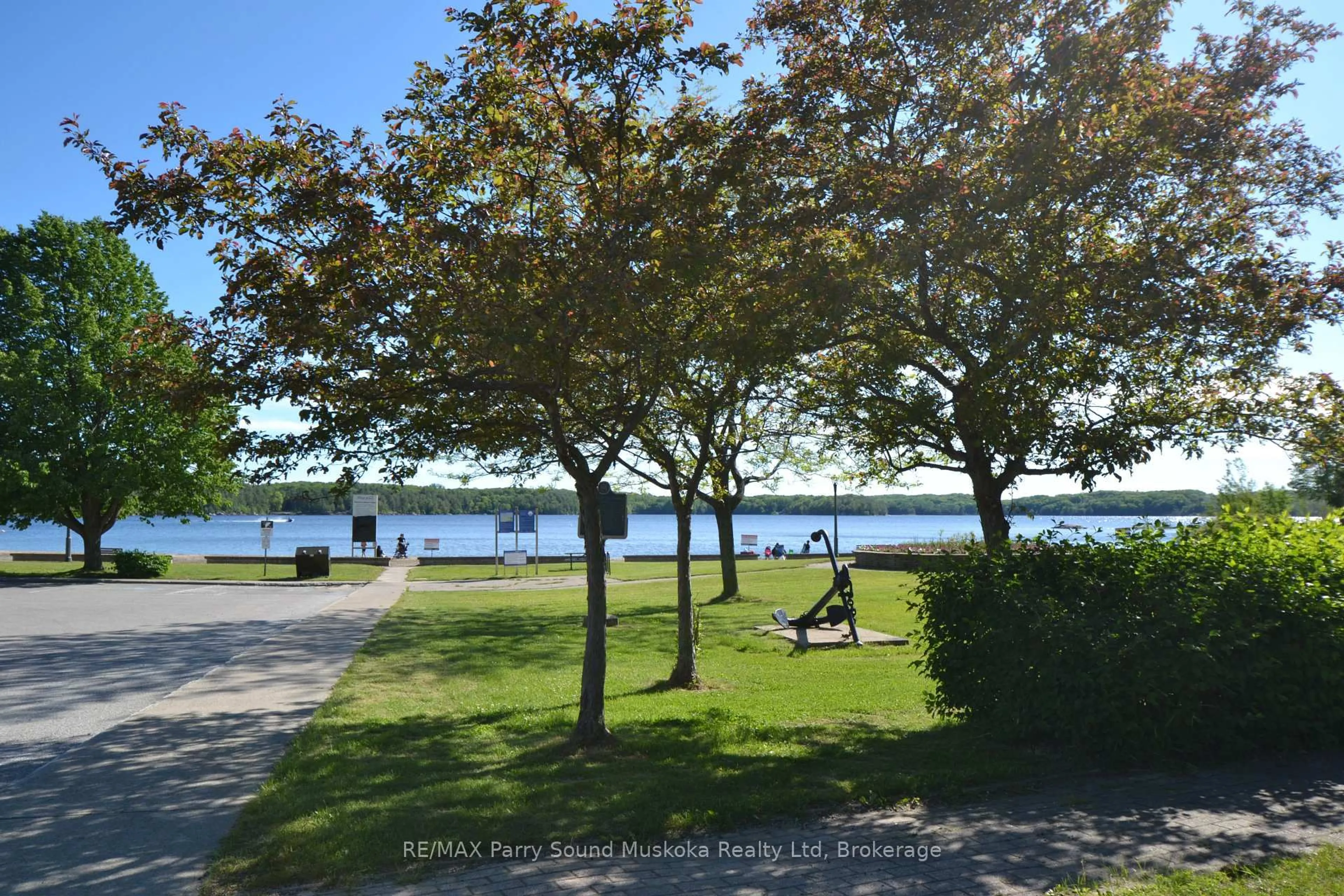 A pic from outside/outdoor area/front of a property/back of a property/a pic from drone, water/lake/river/ocean view for 21 Prospect St ##10, Parry Sound Ontario P2A 2B5