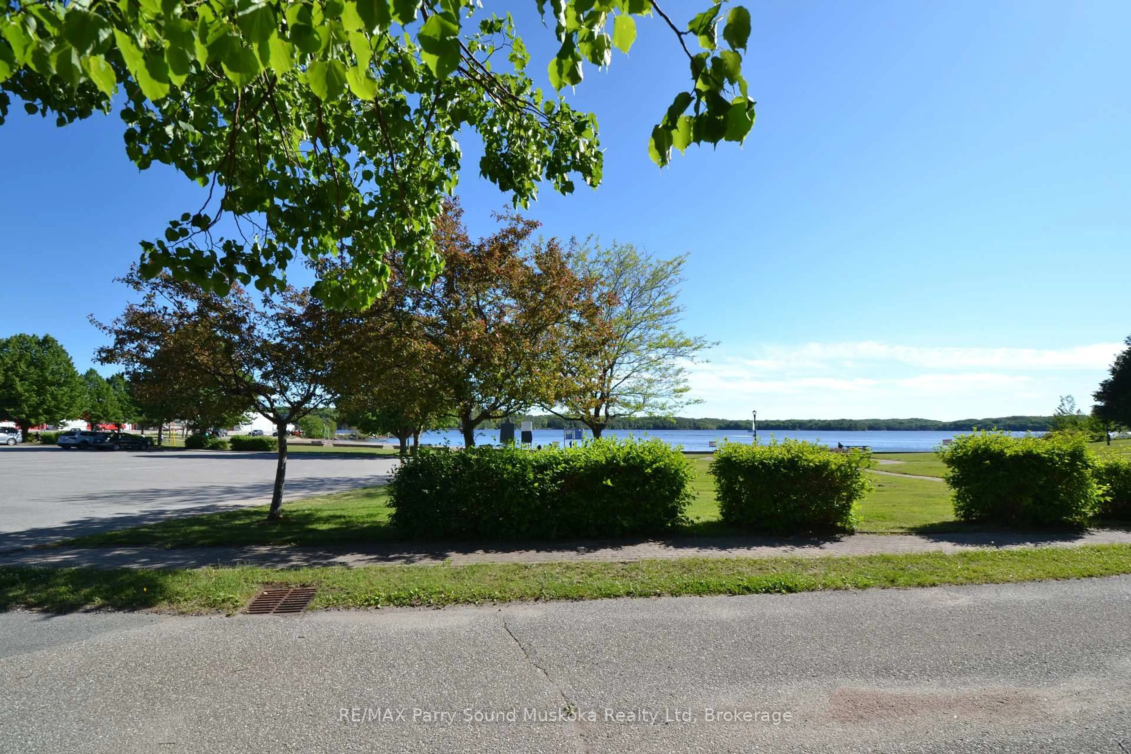 A pic from outside/outdoor area/front of a property/back of a property/a pic from drone, water/lake/river/ocean view for 21 Prospect St ##10, Parry Sound Ontario P2A 2B5