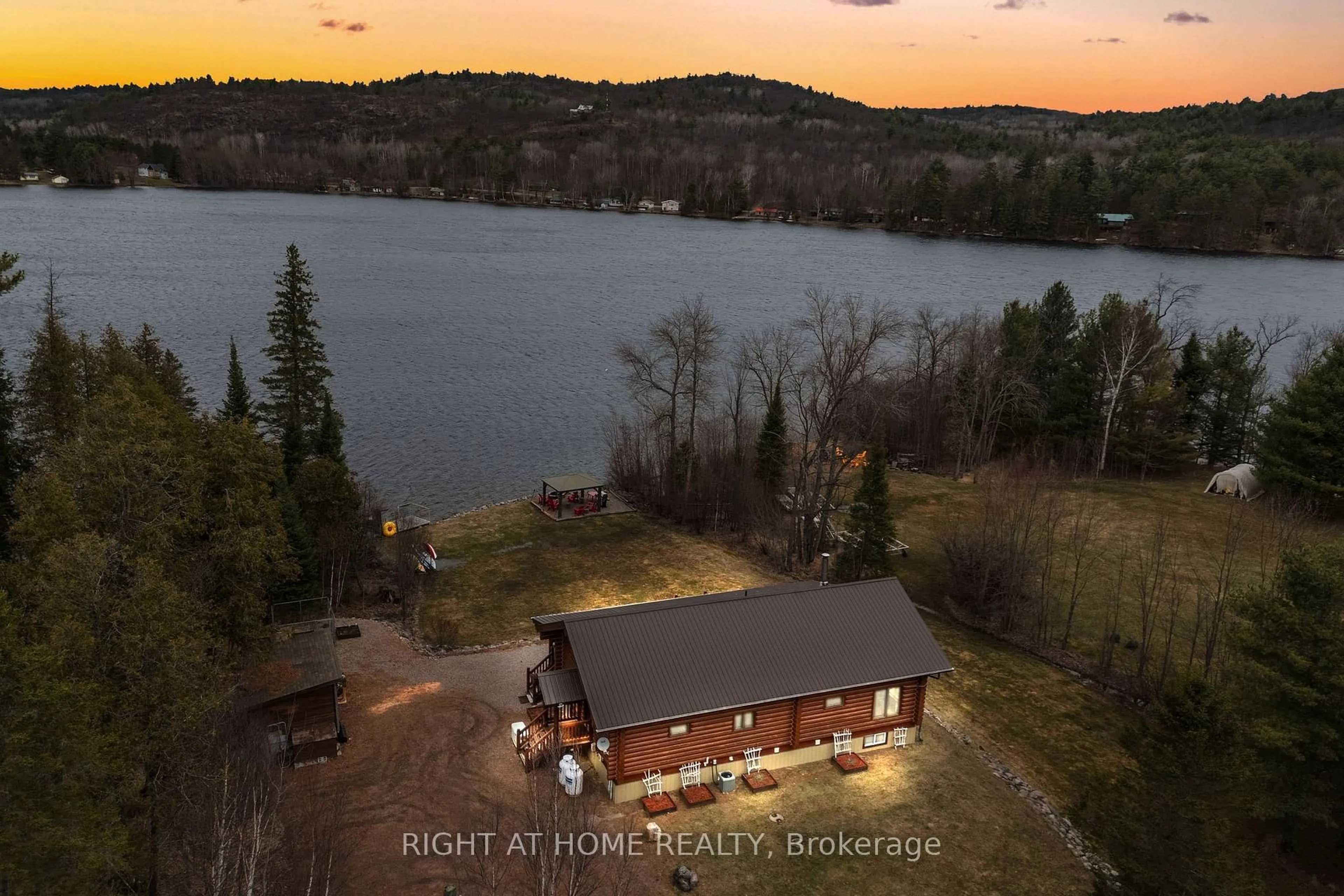 A pic from outside/outdoor area/front of a property/back of a property/a pic from drone, water/lake/river/ocean view for 121 Muskie Lane, Golden Lake Ontario K0J 1X0