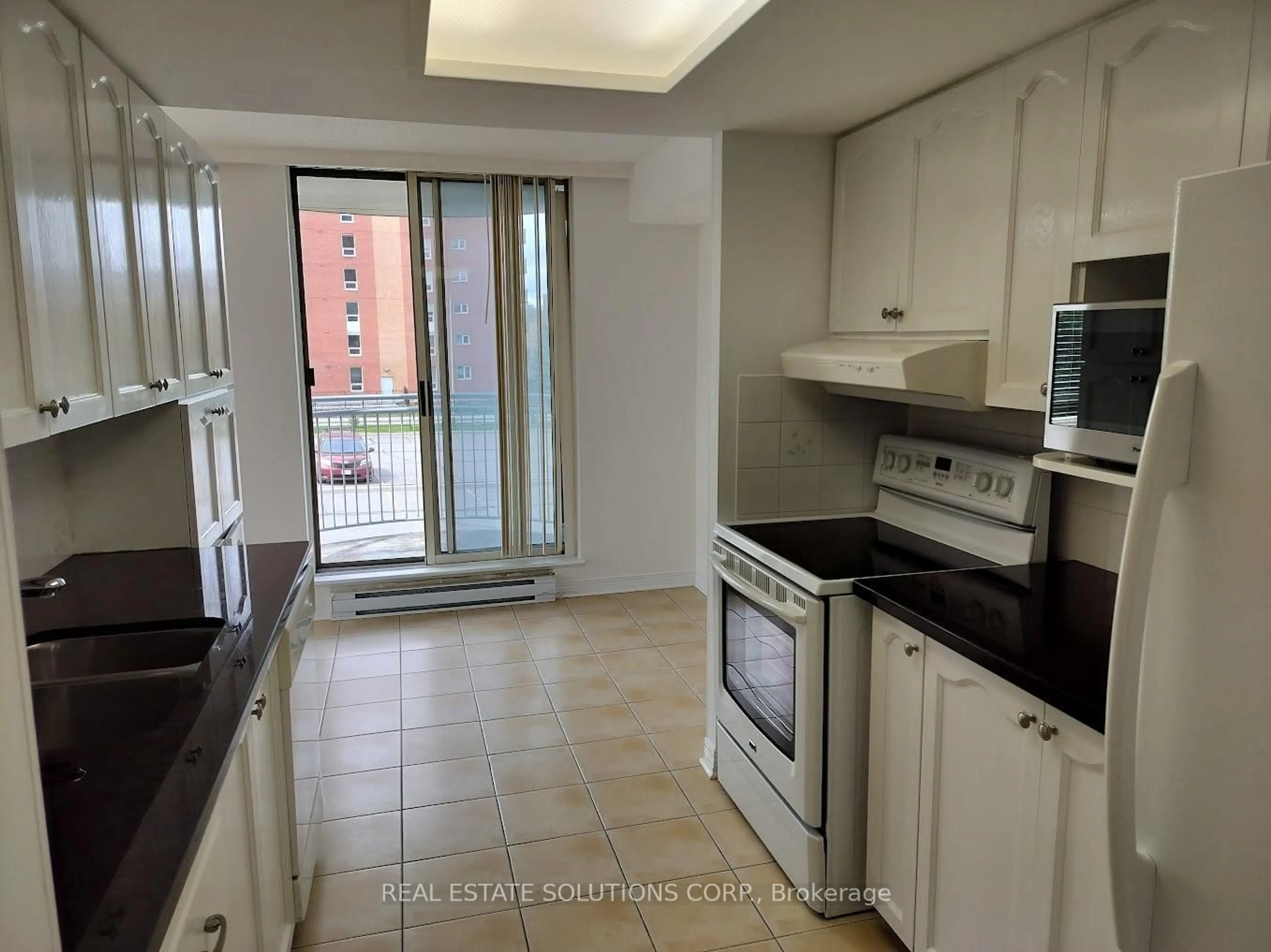 Standard kitchen, ceramic/tile floor for 100 Grant Carman Dr #214, Ottawa Ontario K2E 8B8