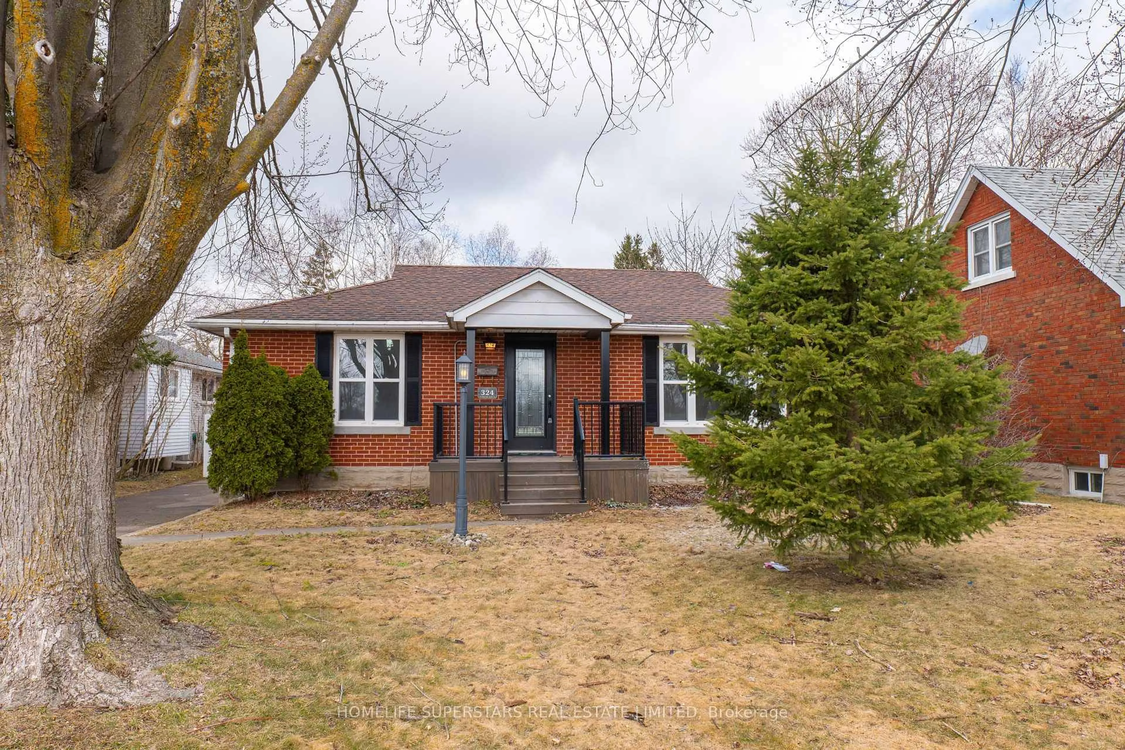 Home with brick exterior material, street for 324 Stirling Ave, Kitchener Ontario N2H 3H4