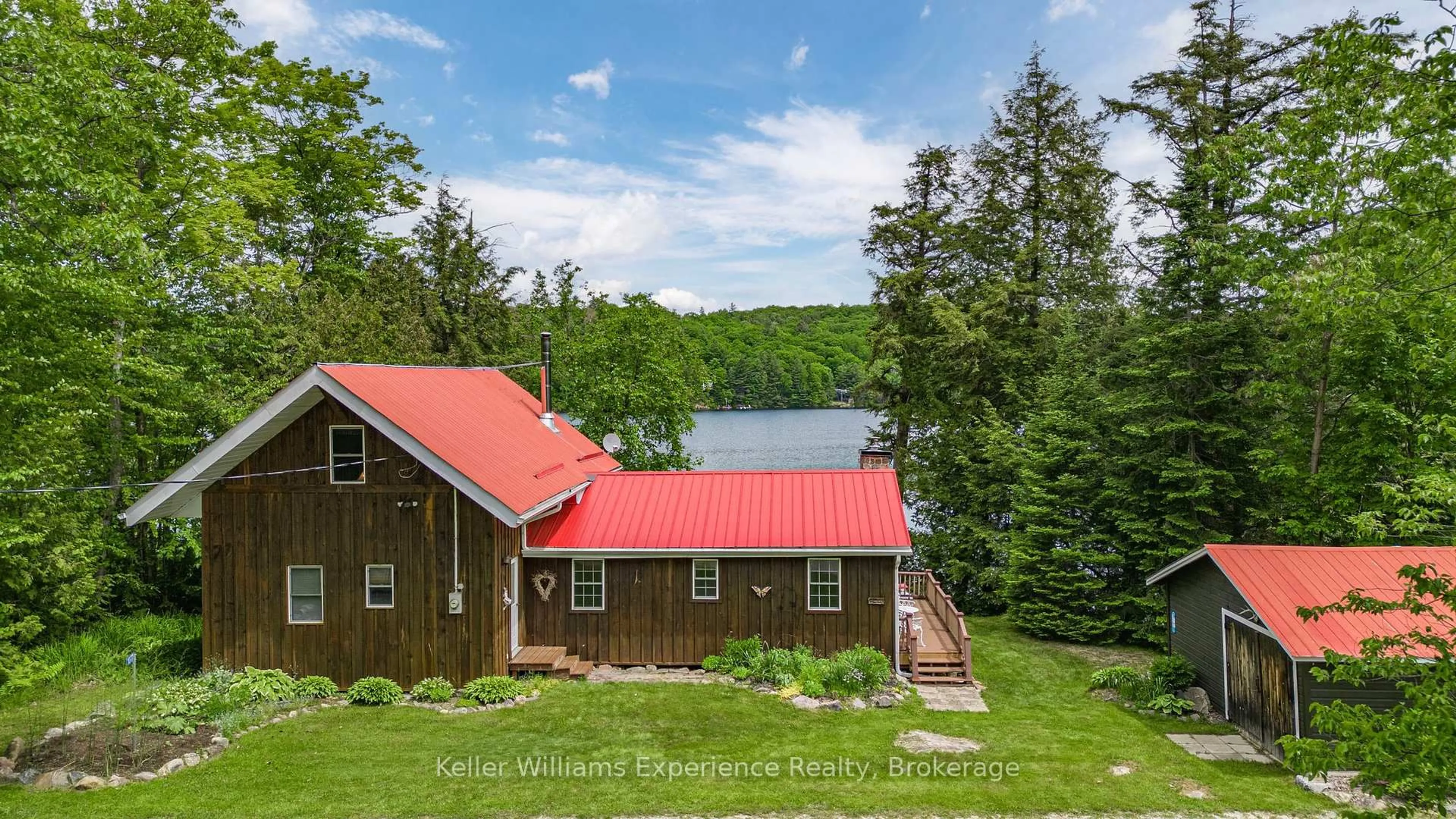 A pic from outside/outdoor area/front of a property/back of a property/a pic from drone, water/lake/river/ocean view for 1077 Friendship Lane, Algonquin Highlands Ontario K0M 1J2