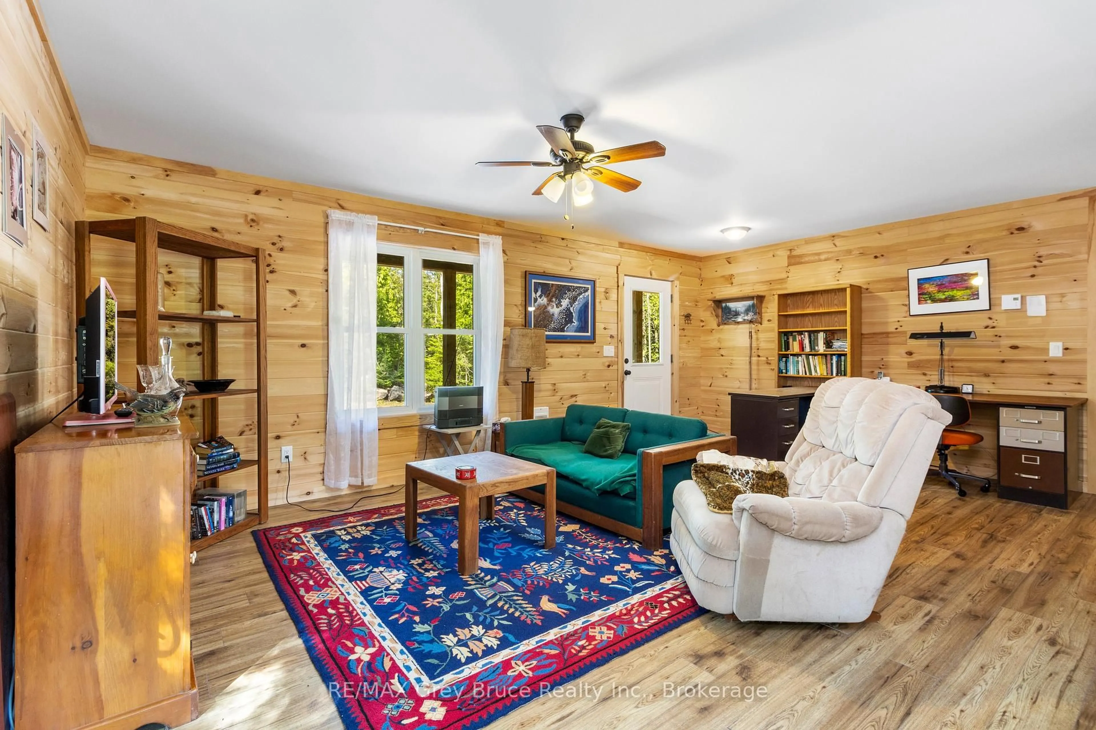 Living room with furniture, wood/laminate floor for 6053 Highway 6 N/A, Northern Bruce Peninsula Ontario N0H 2R0
