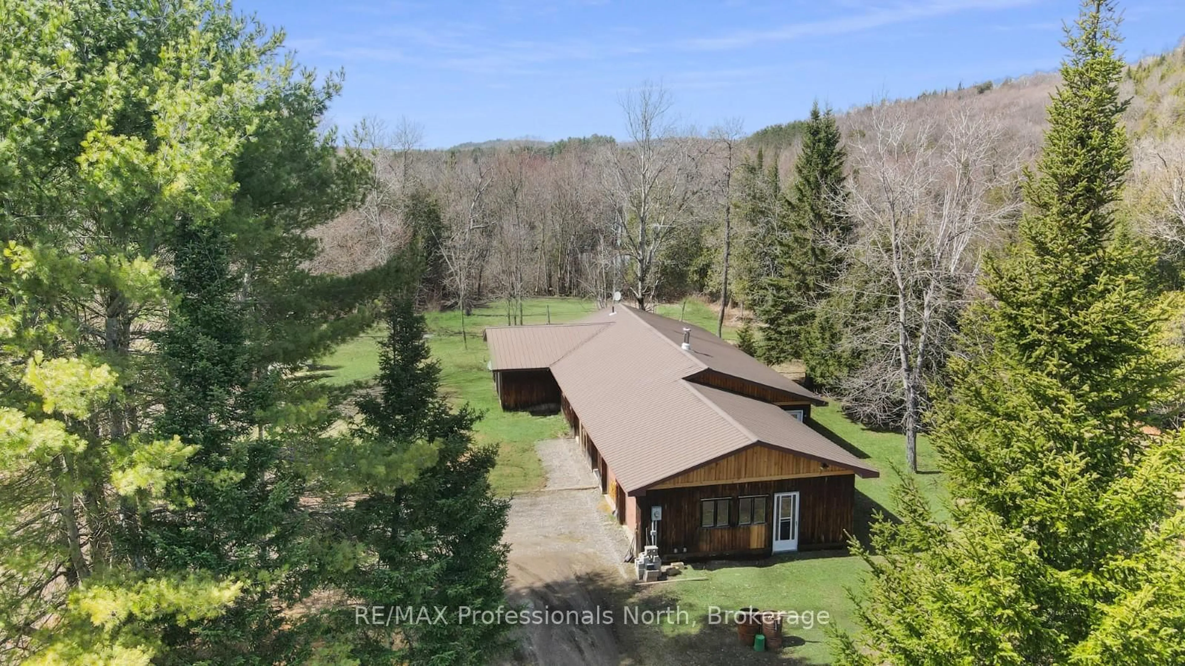 A pic from outside/outdoor area/front of a property/back of a property/a pic from drone, unknown for 11601 Highway 118 Highway, Dysart et al Ontario K0M 1S0