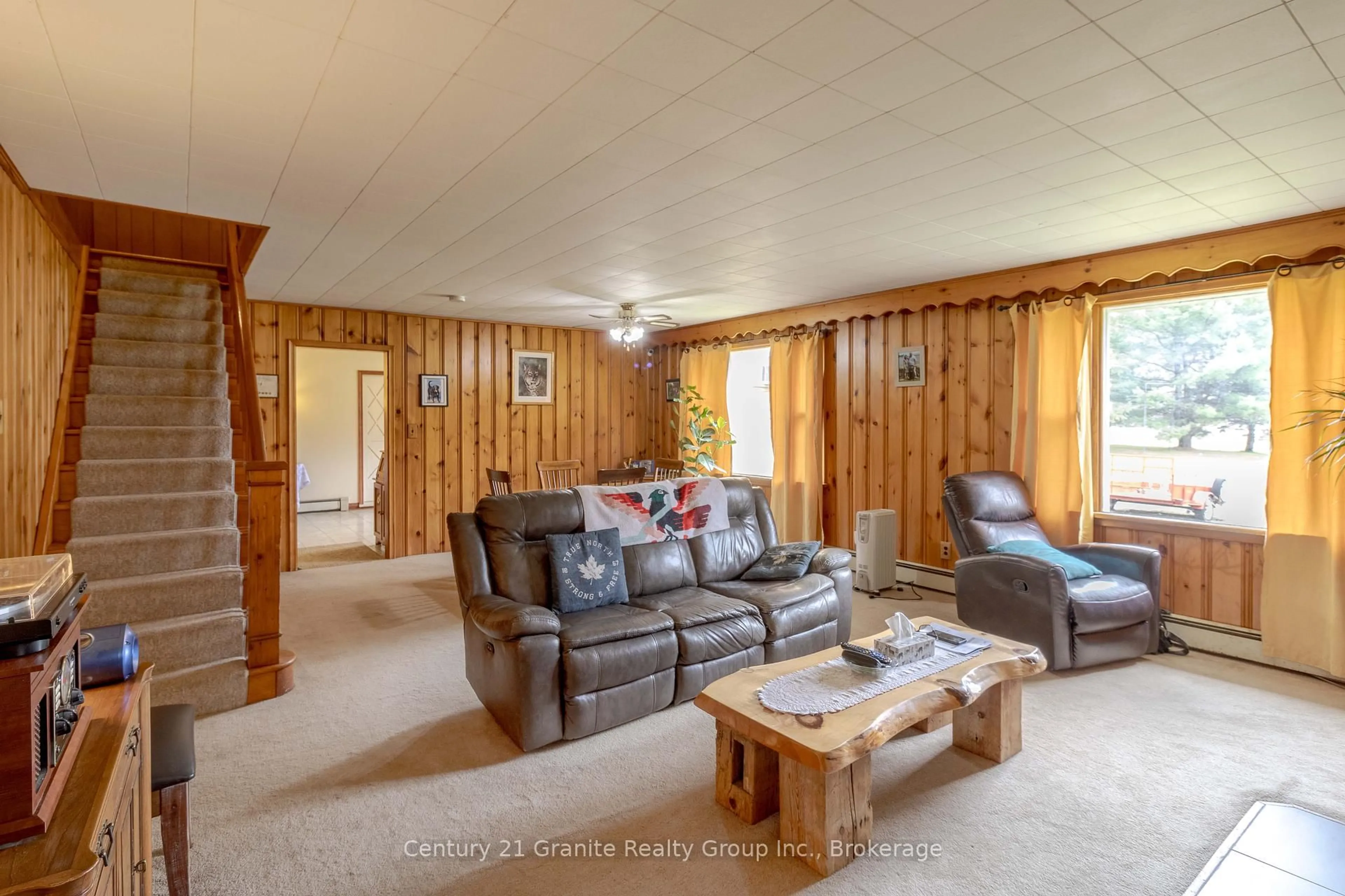 Living room with furniture, wood/laminate floor for 9271 Highway 118 N/A, Minden Hills Ontario K0M 2K0