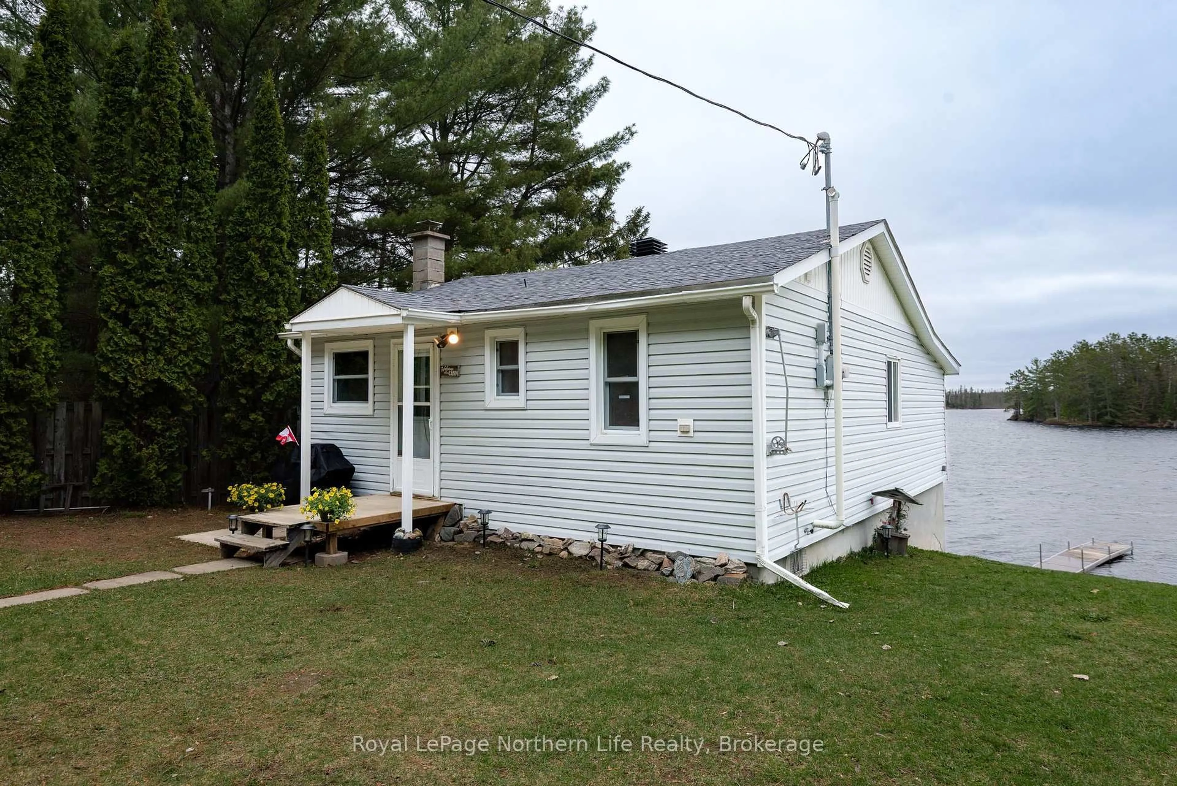 Home with vinyl exterior material, street for 45 Lionel Rd, West Nipissing Ontario P0H 2M0
