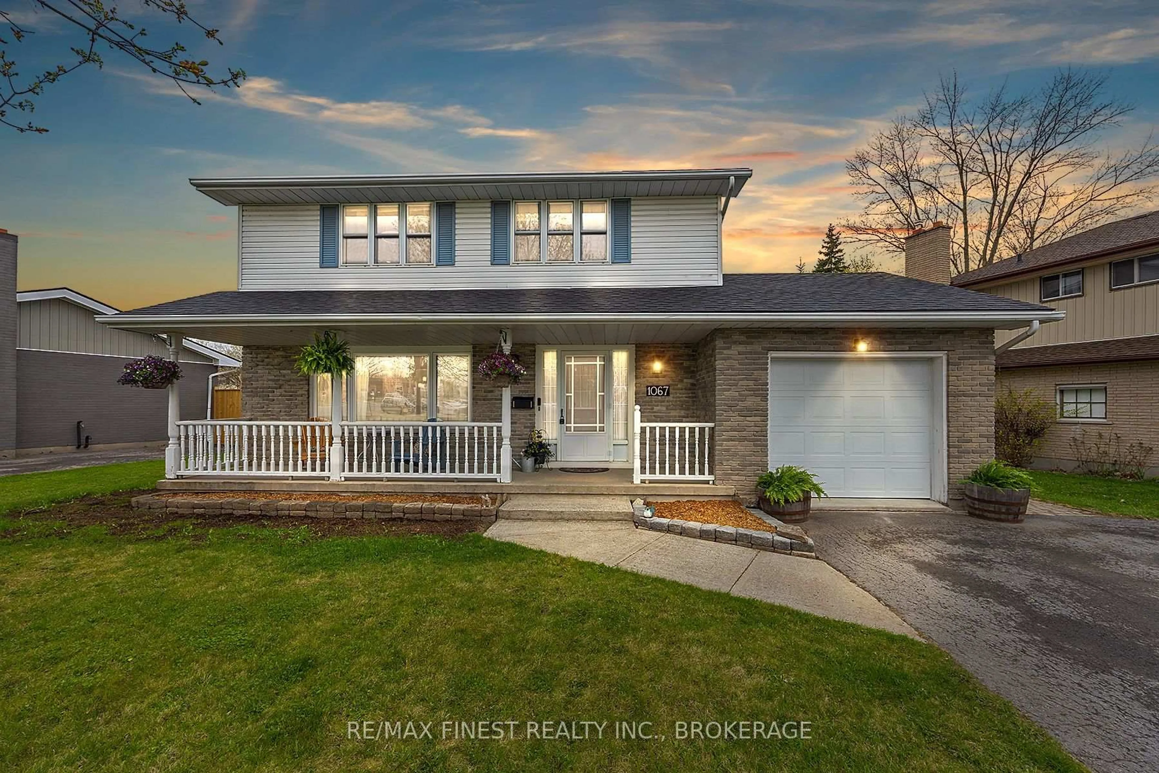 Home with vinyl exterior material, street for 1067 Hudson Dr, Kingston Ontario K7M 5K9