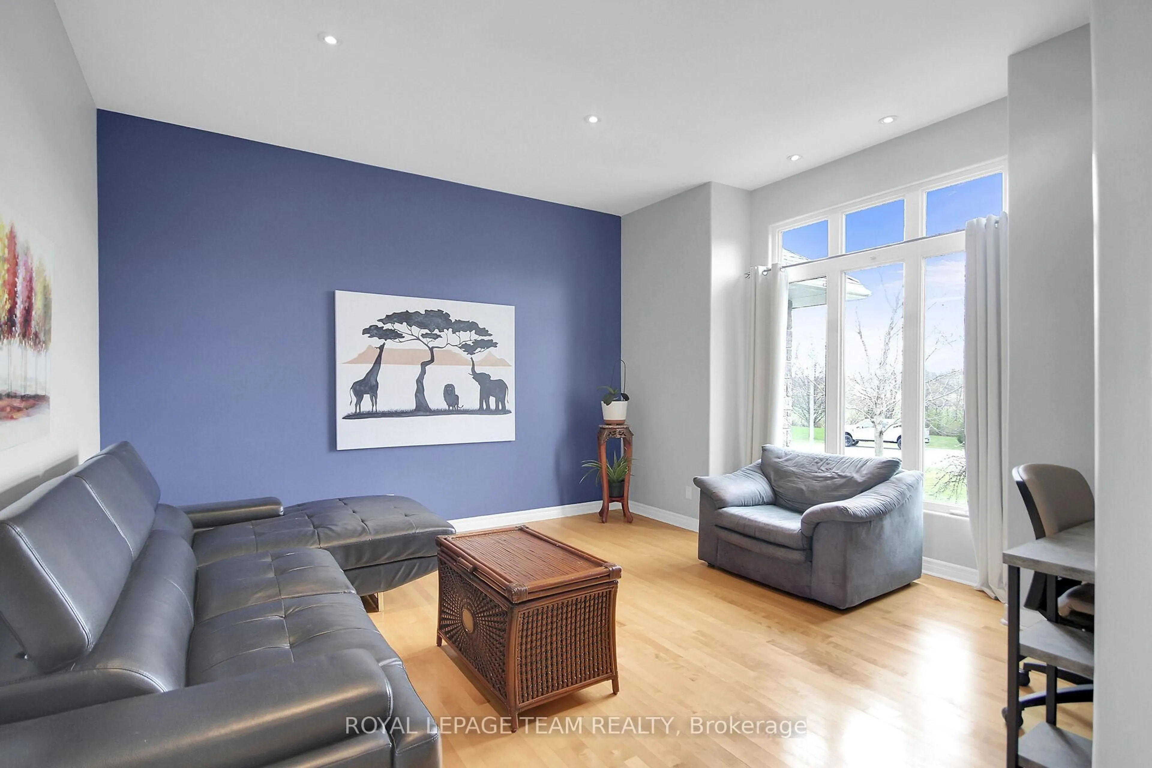 Living room with furniture, wood/laminate floor for 2127 Trailwood Dr, North Gower Ontario K0A 2T0
