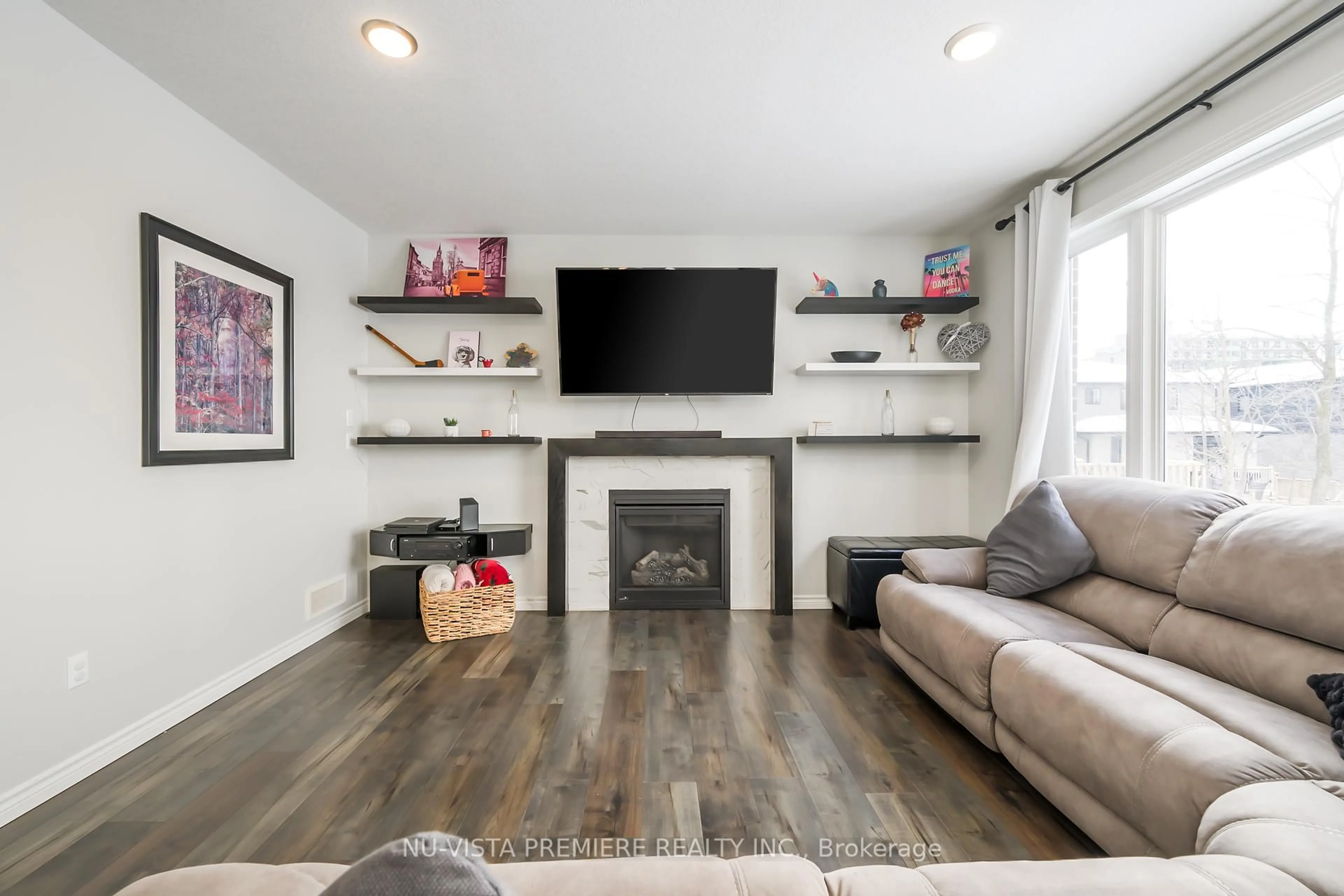 Living room with furniture, wood/laminate floor for 457 Jessica Way Rd, London North Ontario N6H 5L4