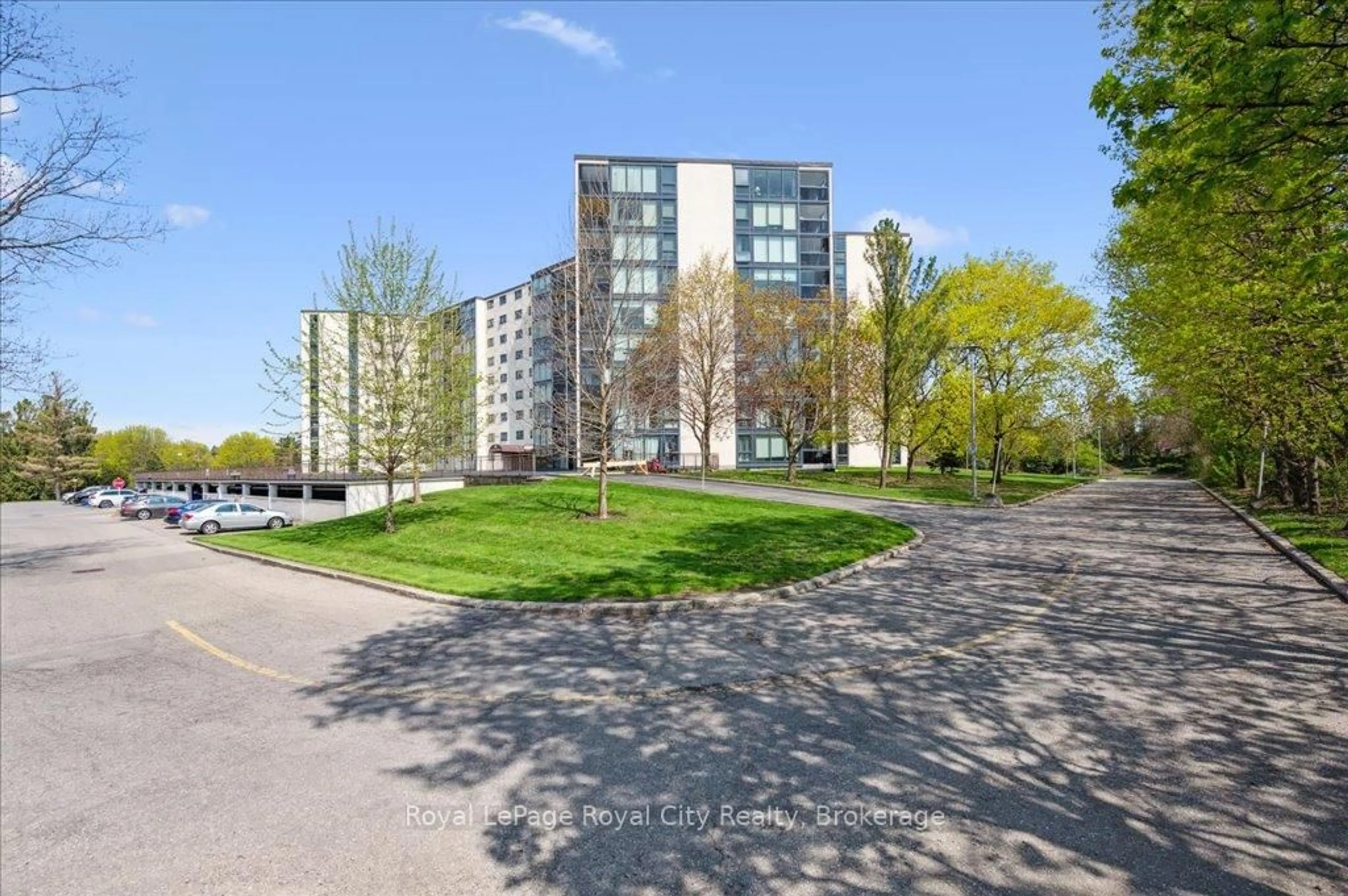 A pic from outside/outdoor area/front of a property/back of a property/a pic from drone, street for 19 Woodlawn Rd #311, Guelph Ontario N1H 7B1