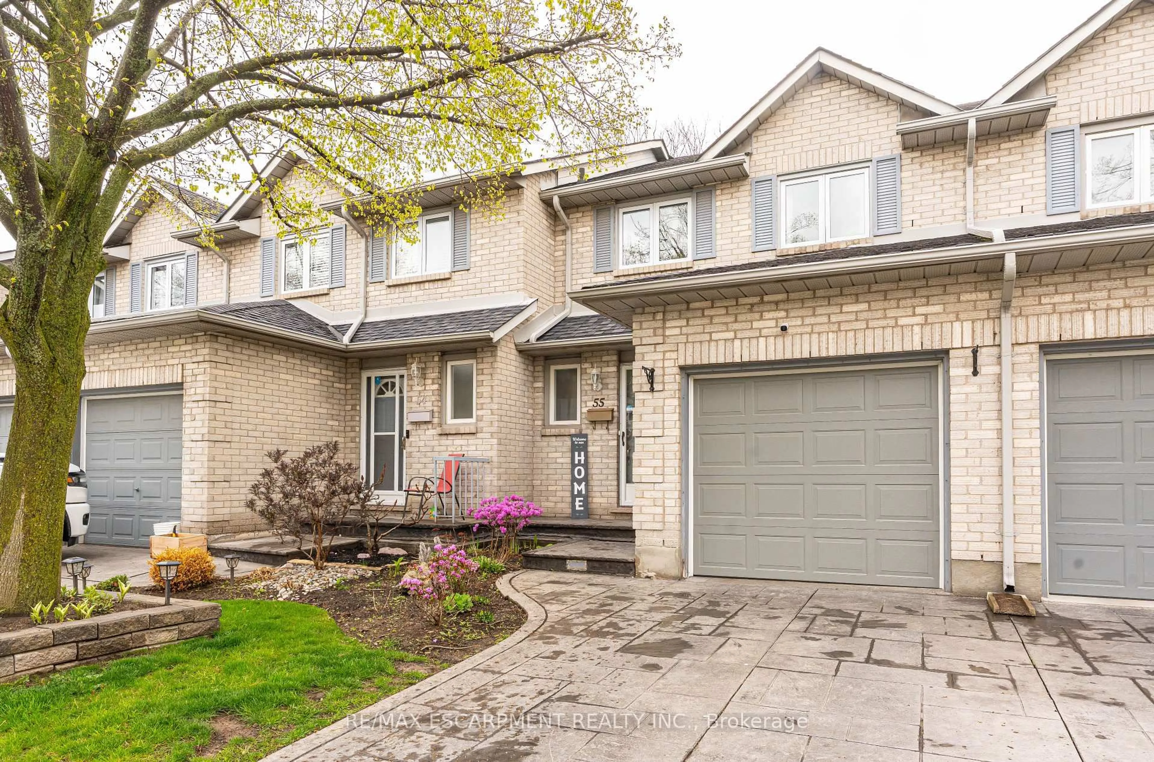 Home with brick exterior material, street for 1 Royalwood Crt #55, Hamilton Ontario L8E 4Y2