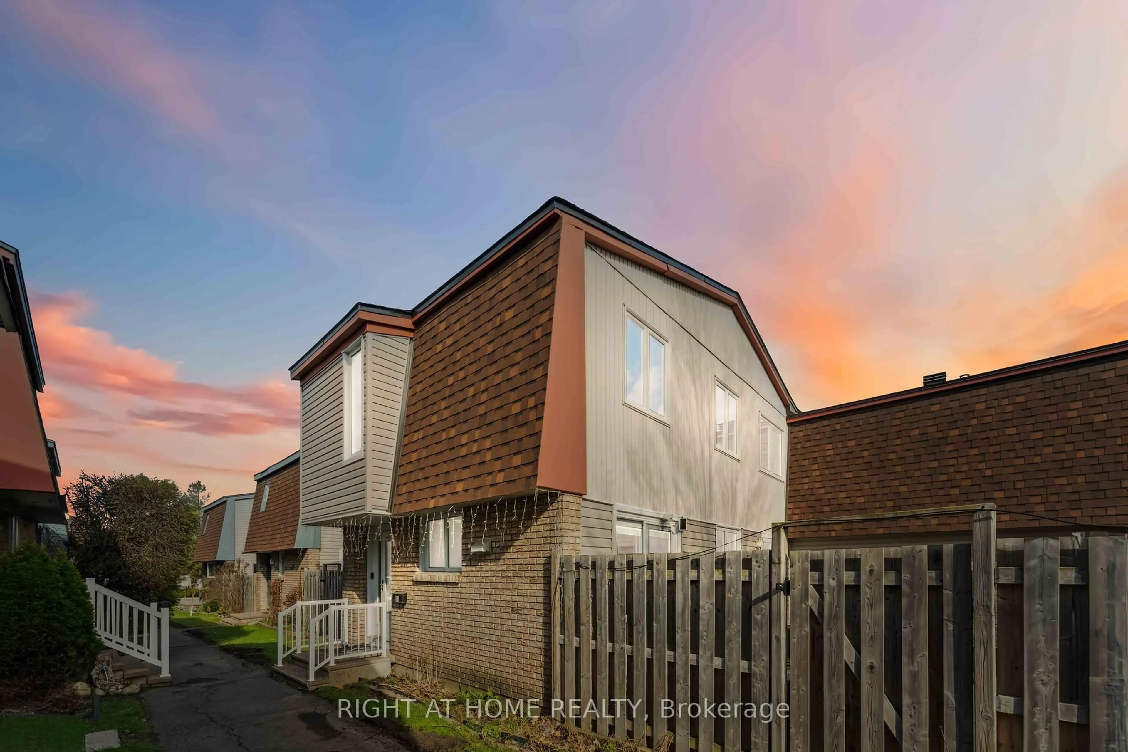Home with brick exterior material, street for 2057 Jasmine Cres #31, Ottawa Ontario K1J 7W2