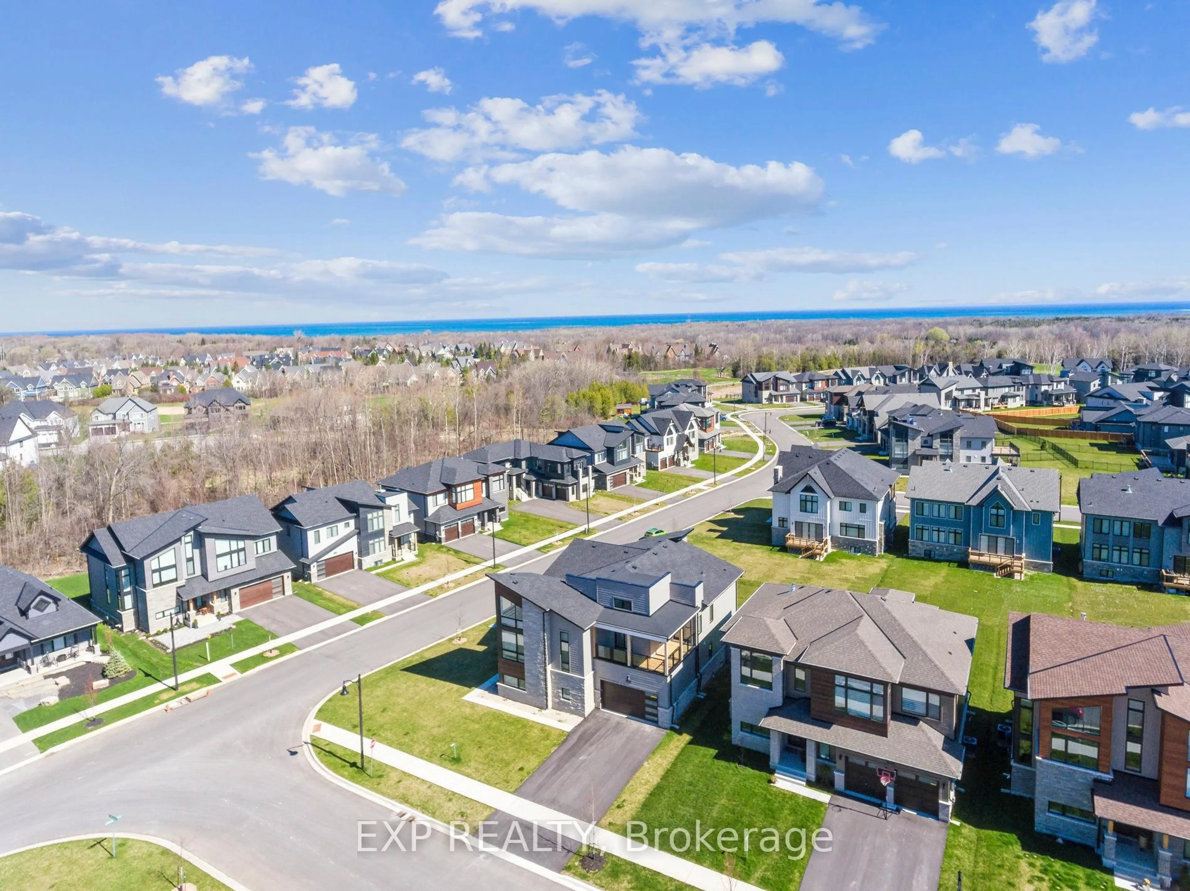 A pic from outside/outdoor area/front of a property/back of a property/a pic from drone, water/lake/river/ocean view for 100 Stoneleigh Dr, Blue Mountains Ontario L9Y 5J6