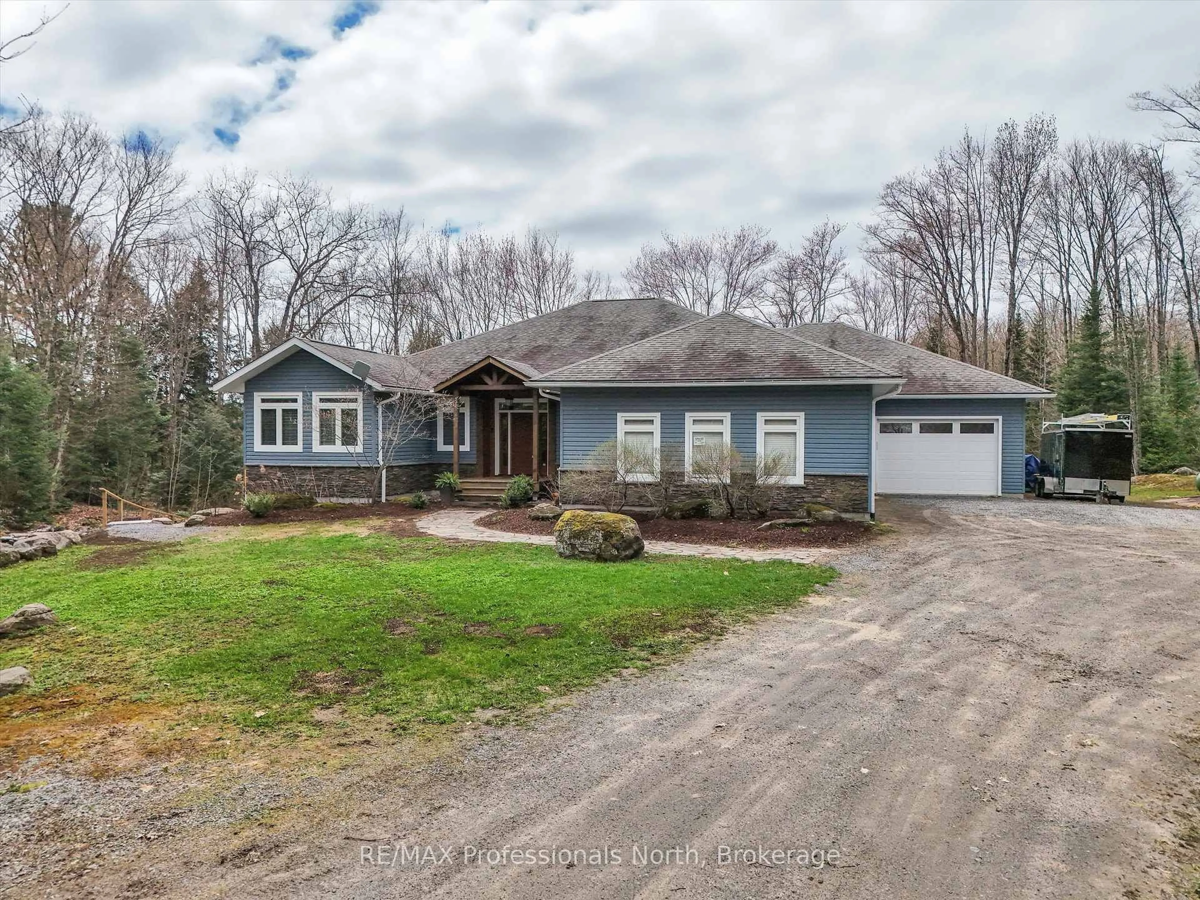 A pic from outside/outdoor area/front of a property/back of a property/a pic from drone, street for 93 Mainhood's Rd, Huntsville Ontario P0B 1M0
